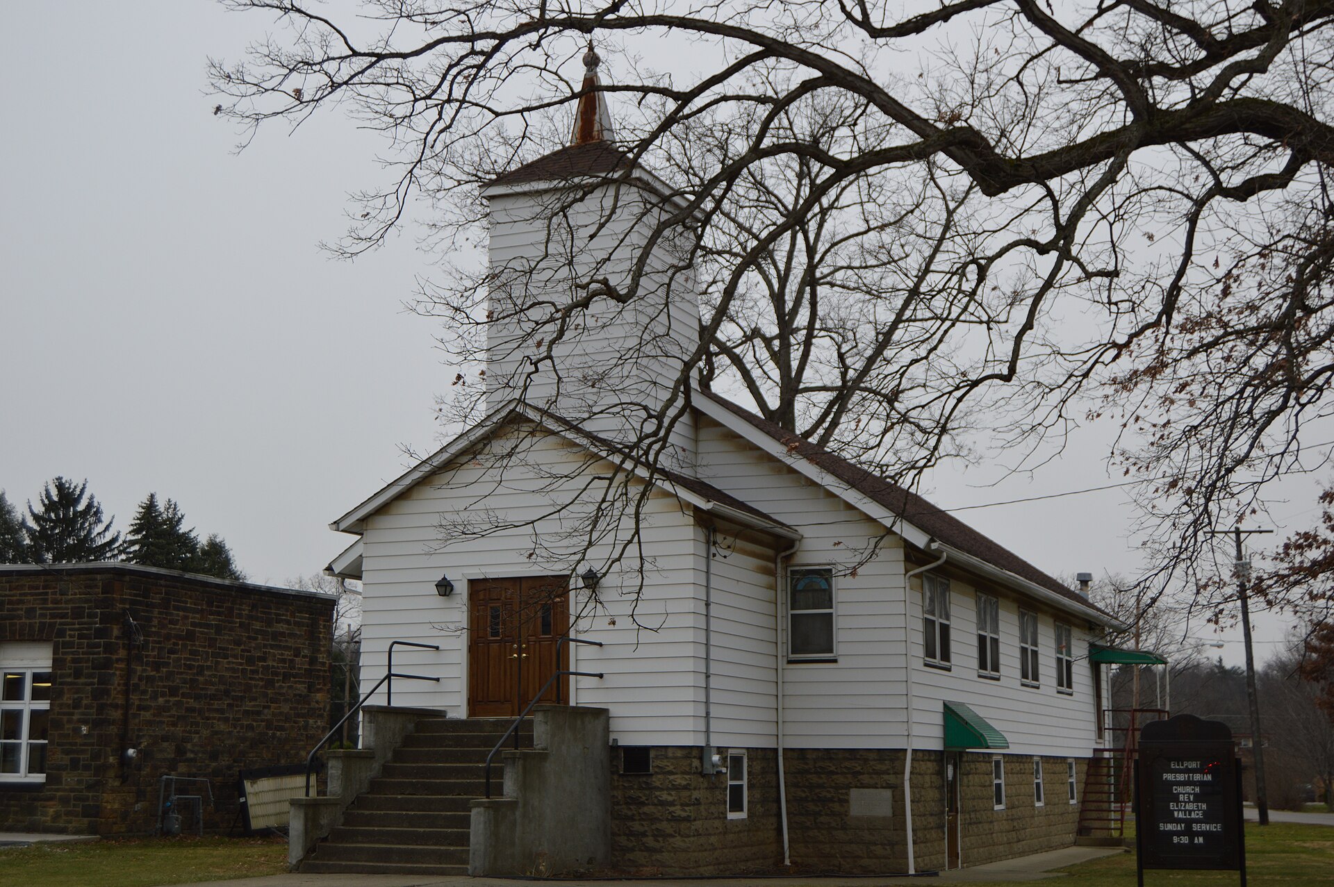 Western side and front of the Ellport Presbyterian Church, located at 221 Portersville Road (Pennsylvania Route 488) in Ellport, Pennsylvania, United States.