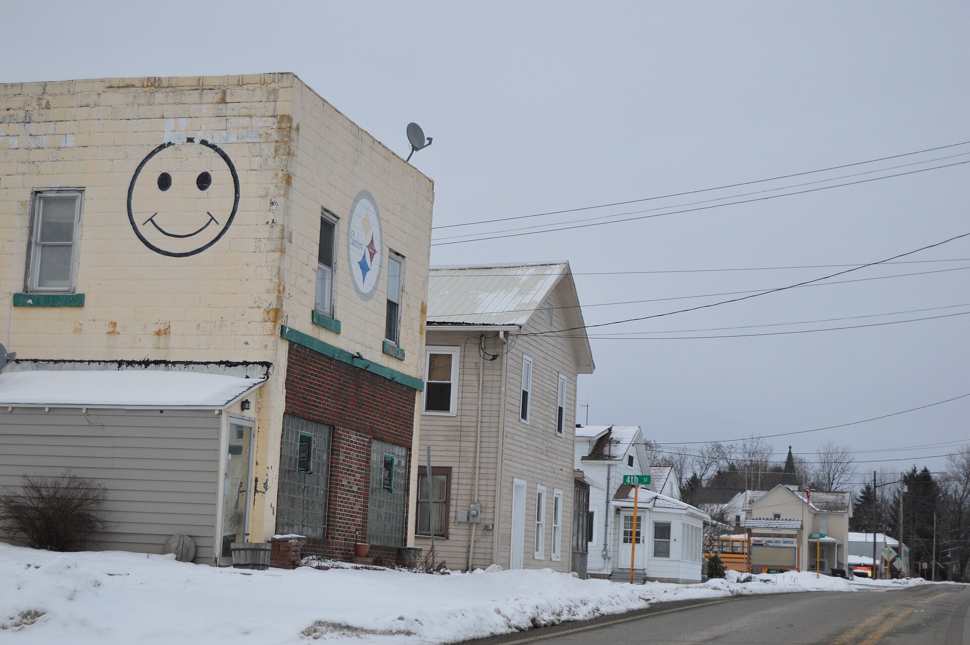 Buildings on the northern side of Plum Street east of the Pennsylvania Route 18 intersection in Harmonsburg, Pennsylvania, United States.