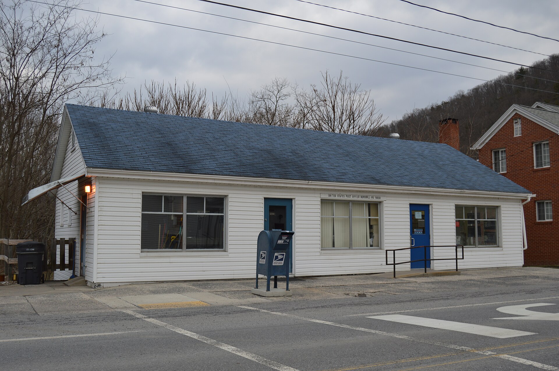 Front of the post office located at 211 Front Street (Pennsylvania Route 915) in Hopewell, Pennsylvania, United States.