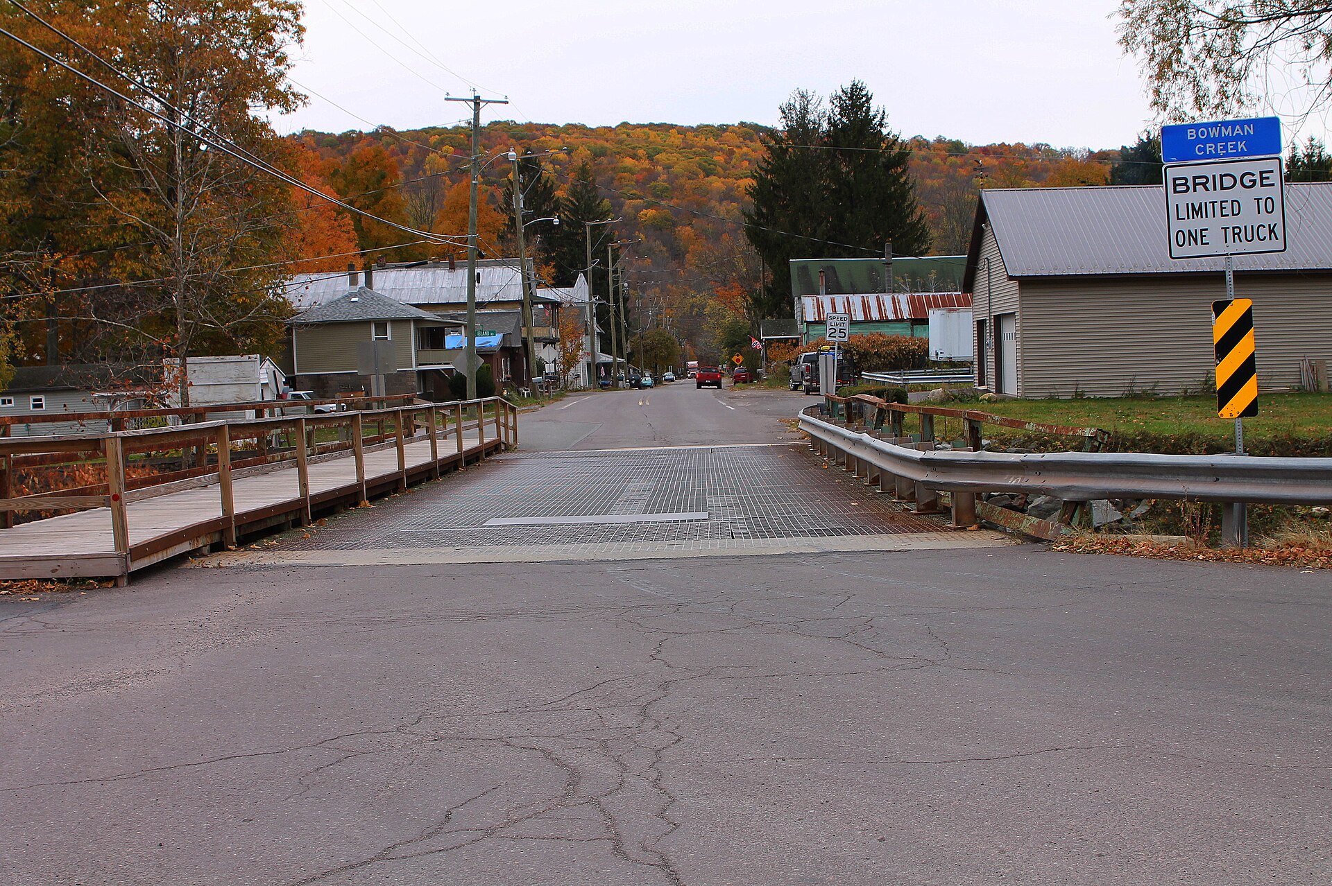 Street in Noxen, Pennsylvania (possibly Main Street?) with a bridge over Bowman Creek