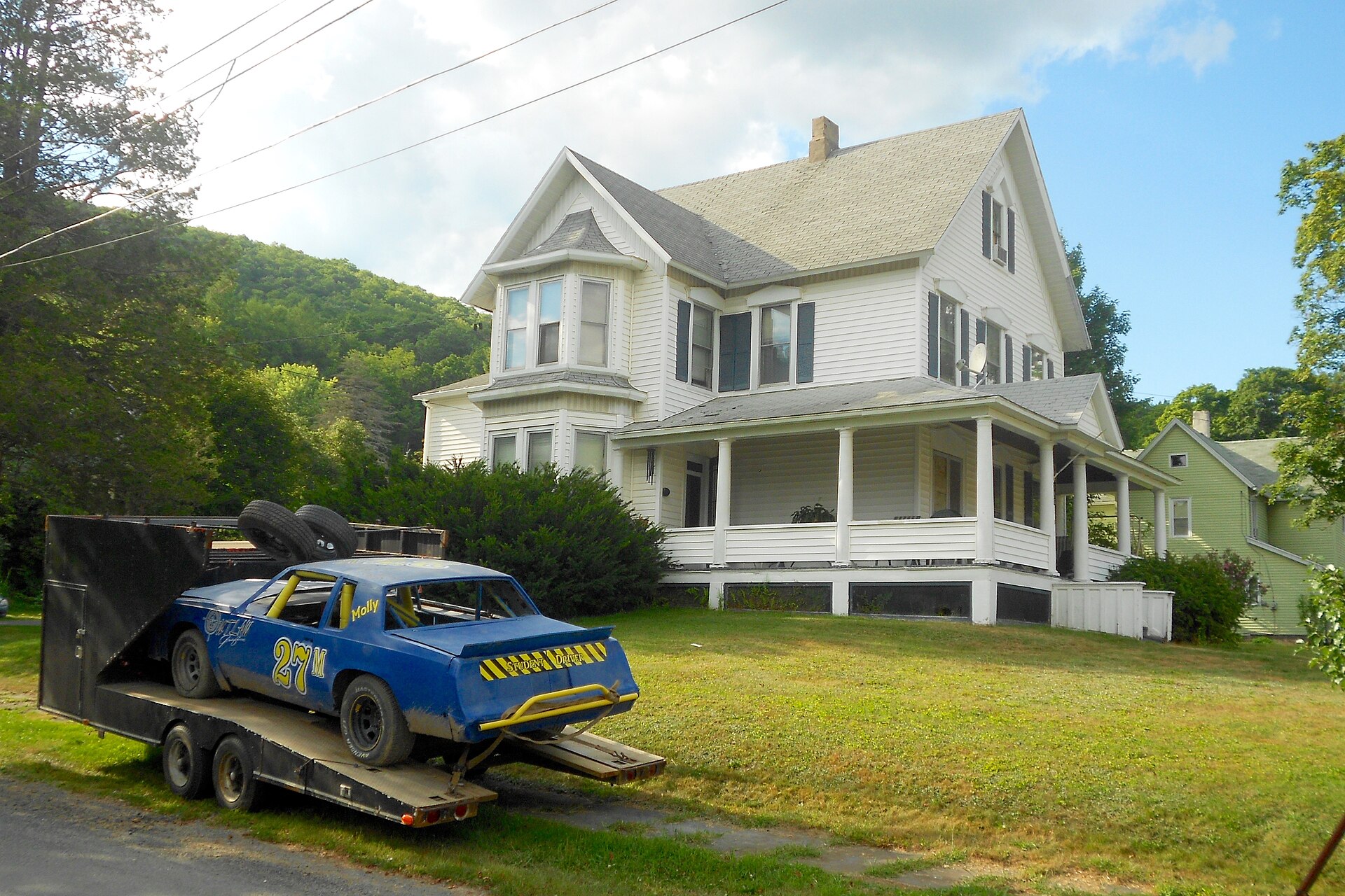 House and stock car in the borough of Oakland, Susquehanna County, Pennsylvania. Note that this Oakland is not the Oakland neighborhood in Pittsburg