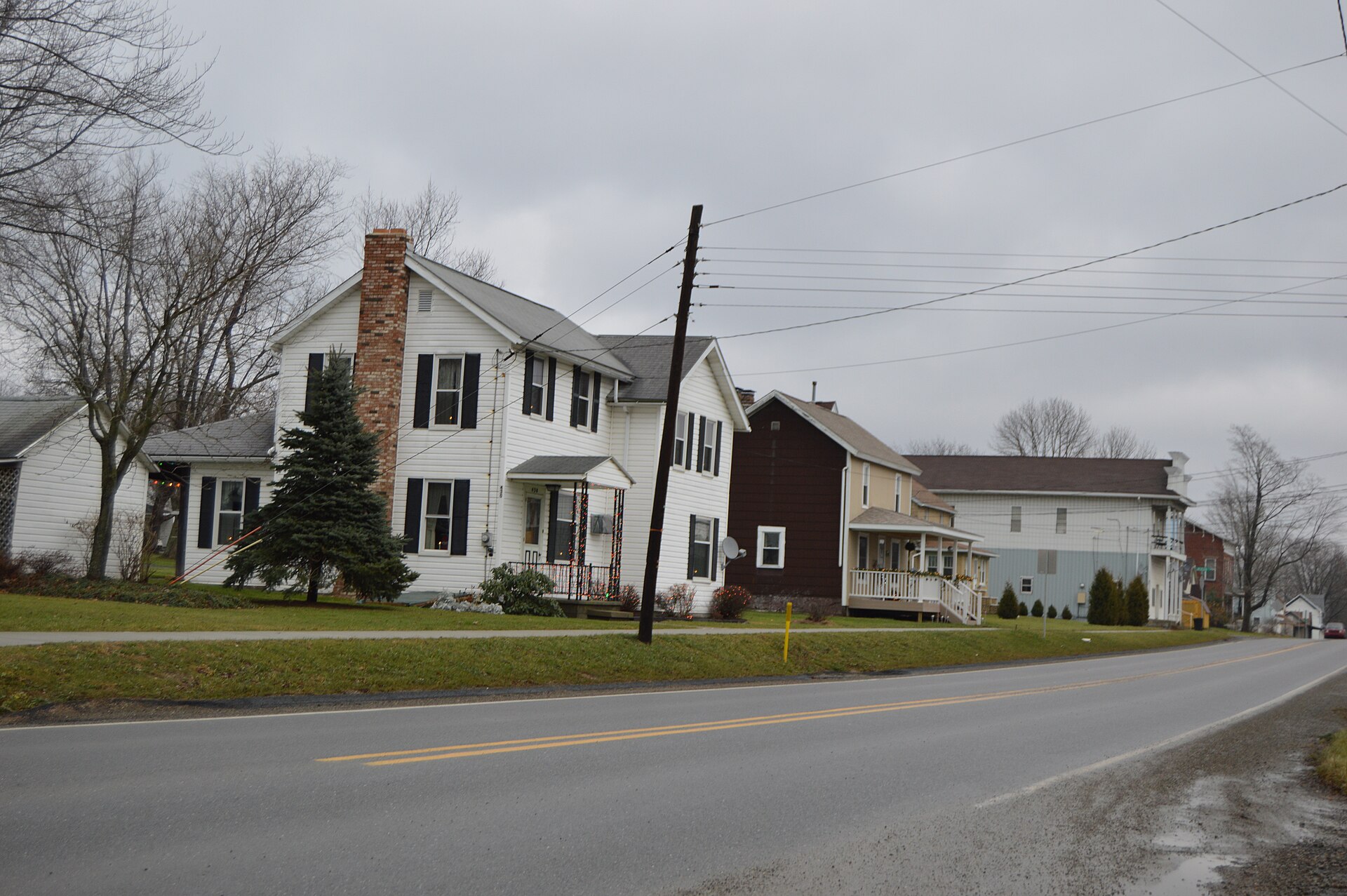 Houses on the northern side of Main Street (U.S. Route 322) in Strattanville, Pennsylvania, United States, seen looking east from the Ridge Avenue intersection.