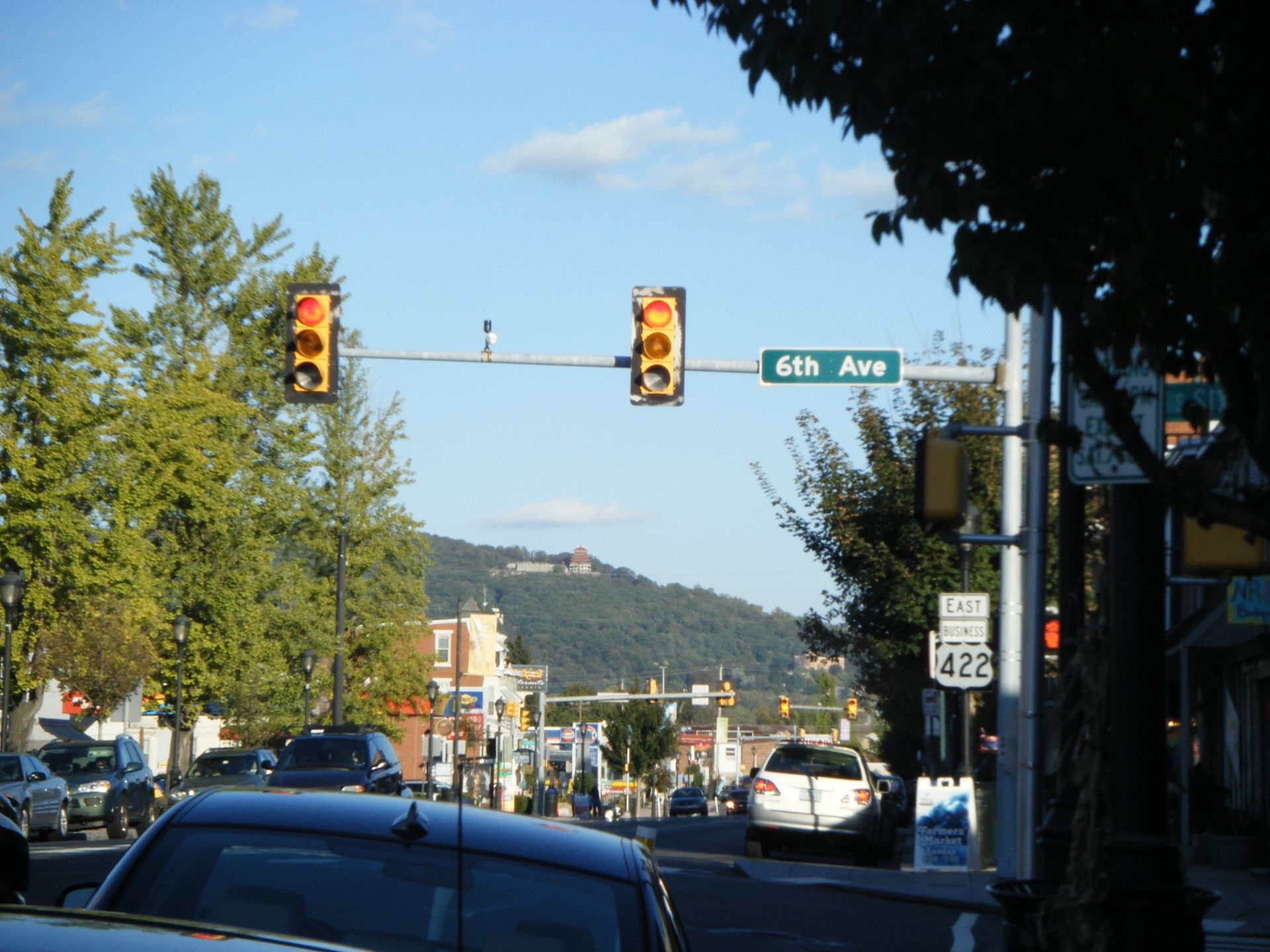 Eastbound U.S. Route 422 Business (Penn Avenue) at the intersection with 6th Avenue in West Reading, Pennsylvania. Mount Penn and the Pagoda can be seen in the background.