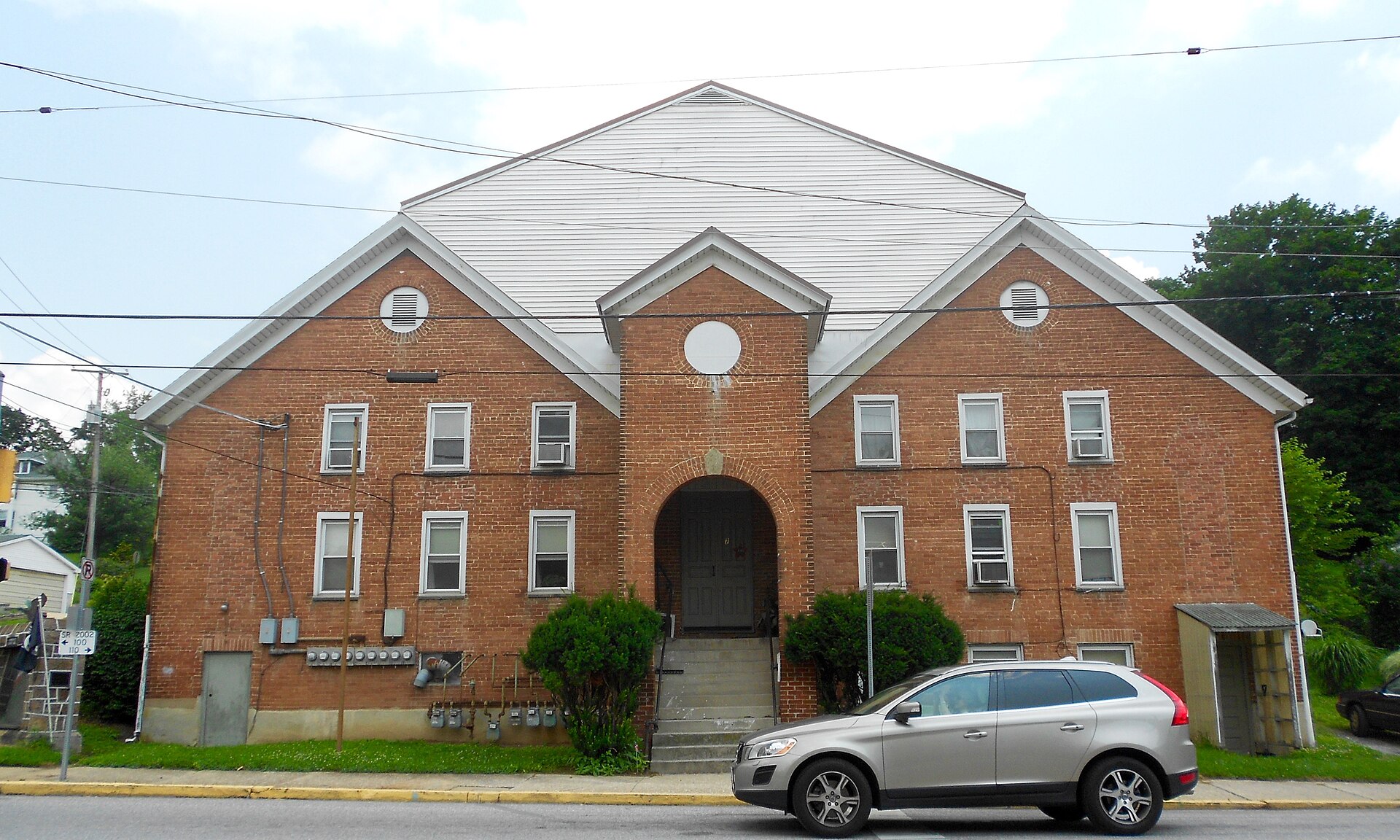 Big old funny apartment building near the center of Yoe, York County, Pennsylvania. A church and the fire station are across the street
