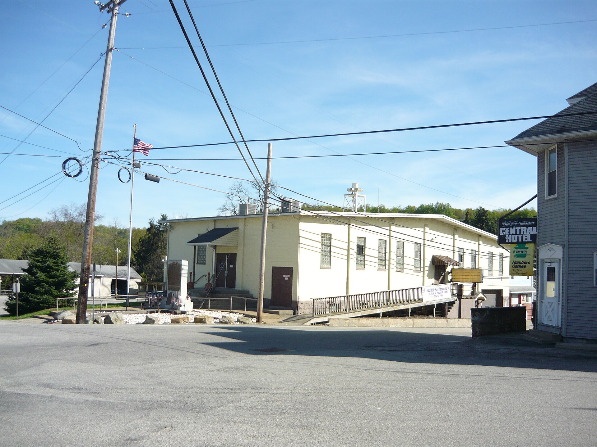 Central Hotel and war memorial in Yukon, South Huntingdon Township, Westmoreland County, Pennsylvania. Shown is the intersection of Keller Avenue, Highway Street, Henry Street, and Station Street.