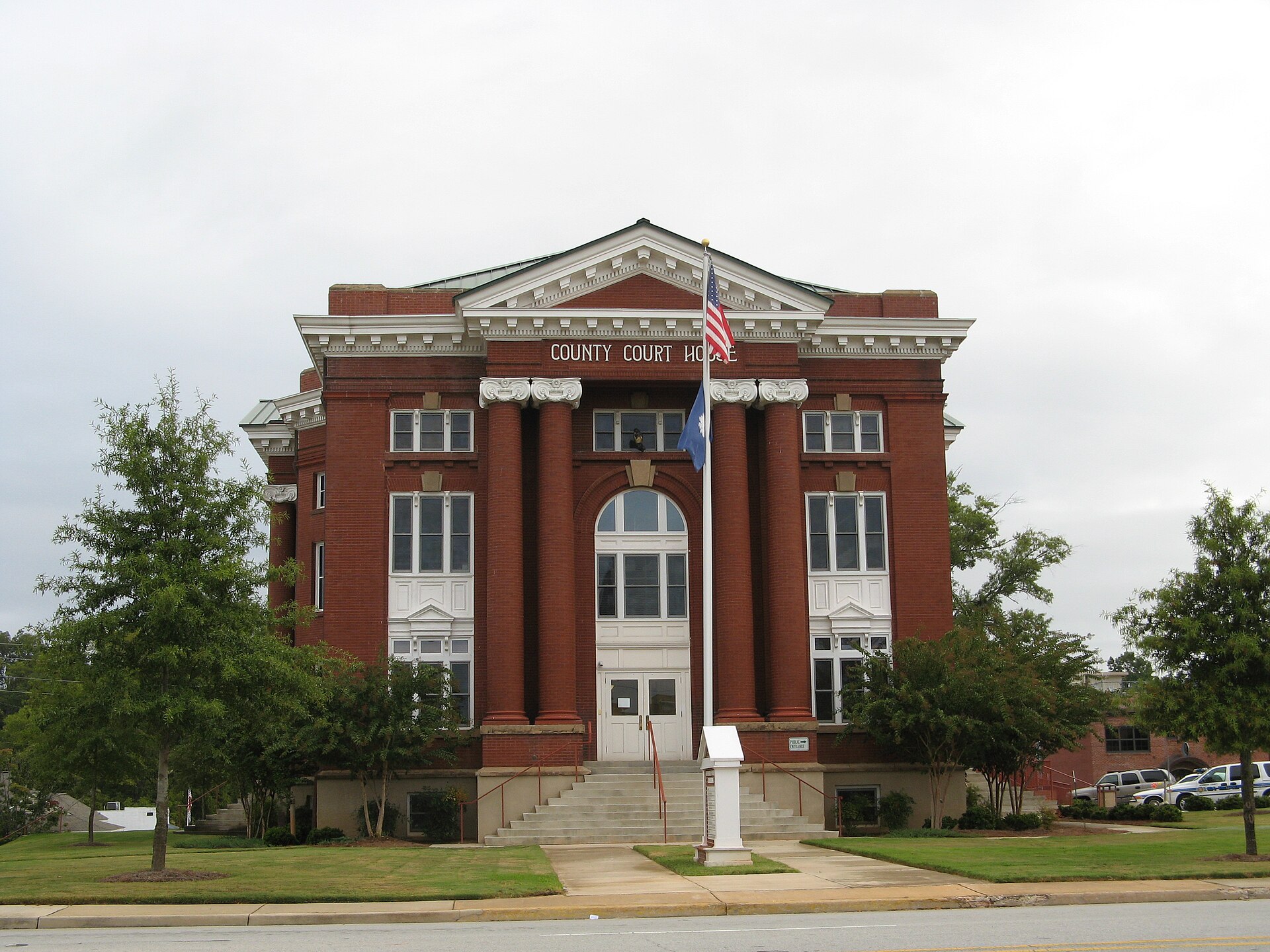 Front of the Newberry County Courthouse, located along College Street immediately south of the Harrington Street intersection in Newberry, South Carolina, United States.