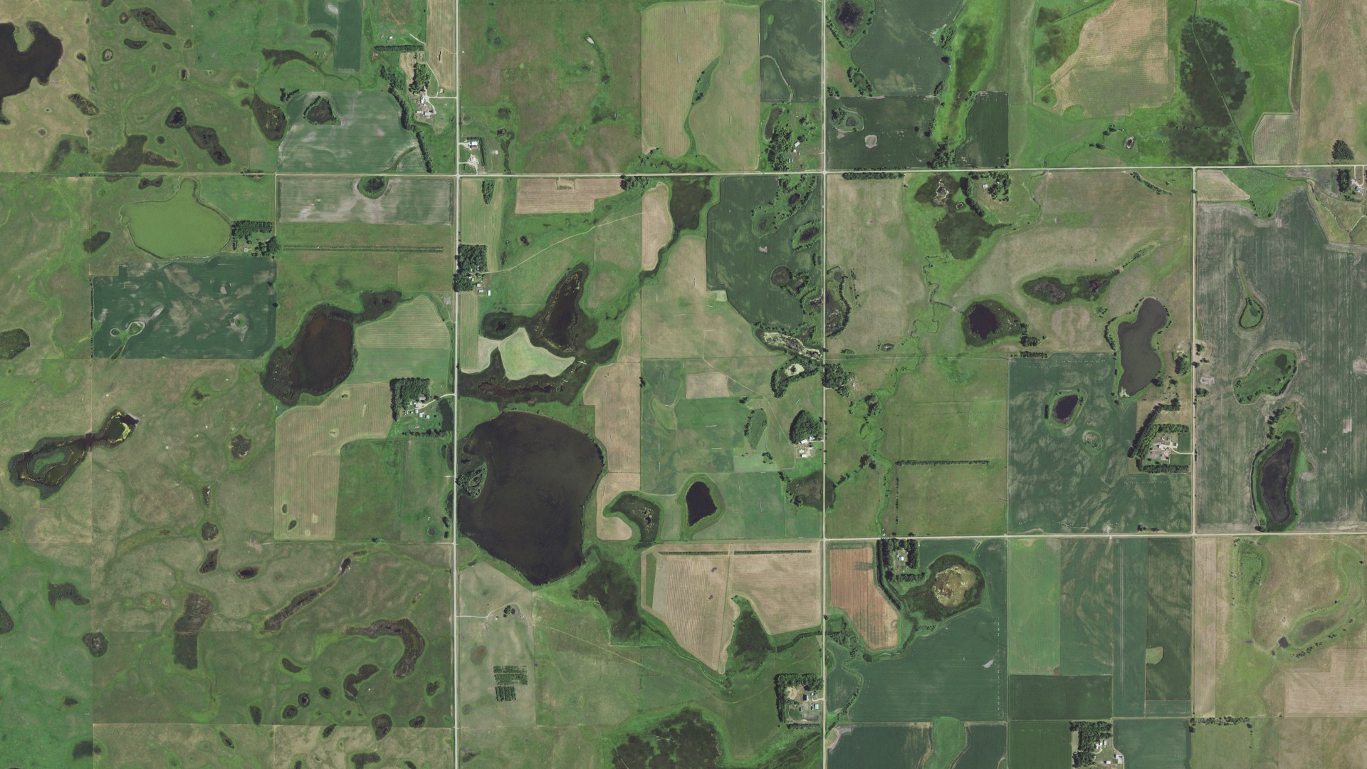 Natural-color aerial photograph of land around Herrick, South Dakota