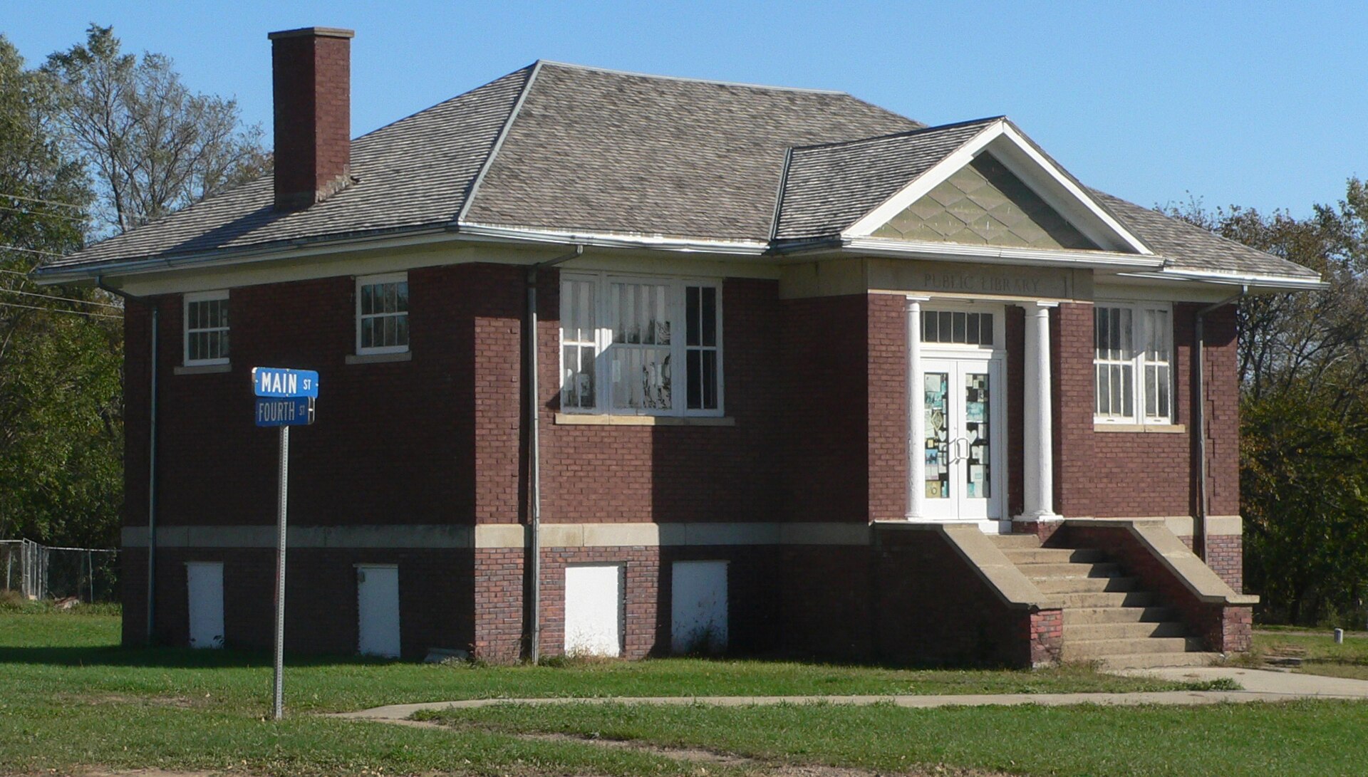 Carnegie library at southeast corner of 4th and Main Streets in Dallas, South Dakota; seen from the northwest. — Gregory County, South Dakota