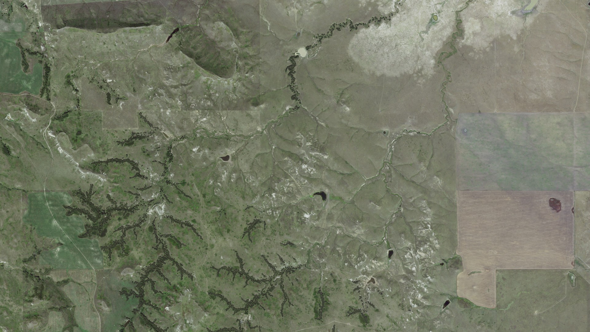 Natural-color aerial photograph of land around Butte, South Dakota