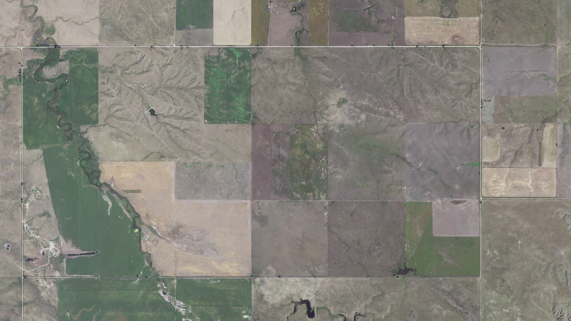 Natural-color aerial photograph of land around Cody, South Dakota