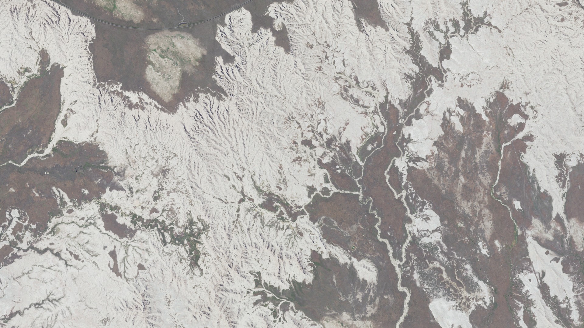 Natural-color aerial photograph of land around Castle Butte, South Dakota