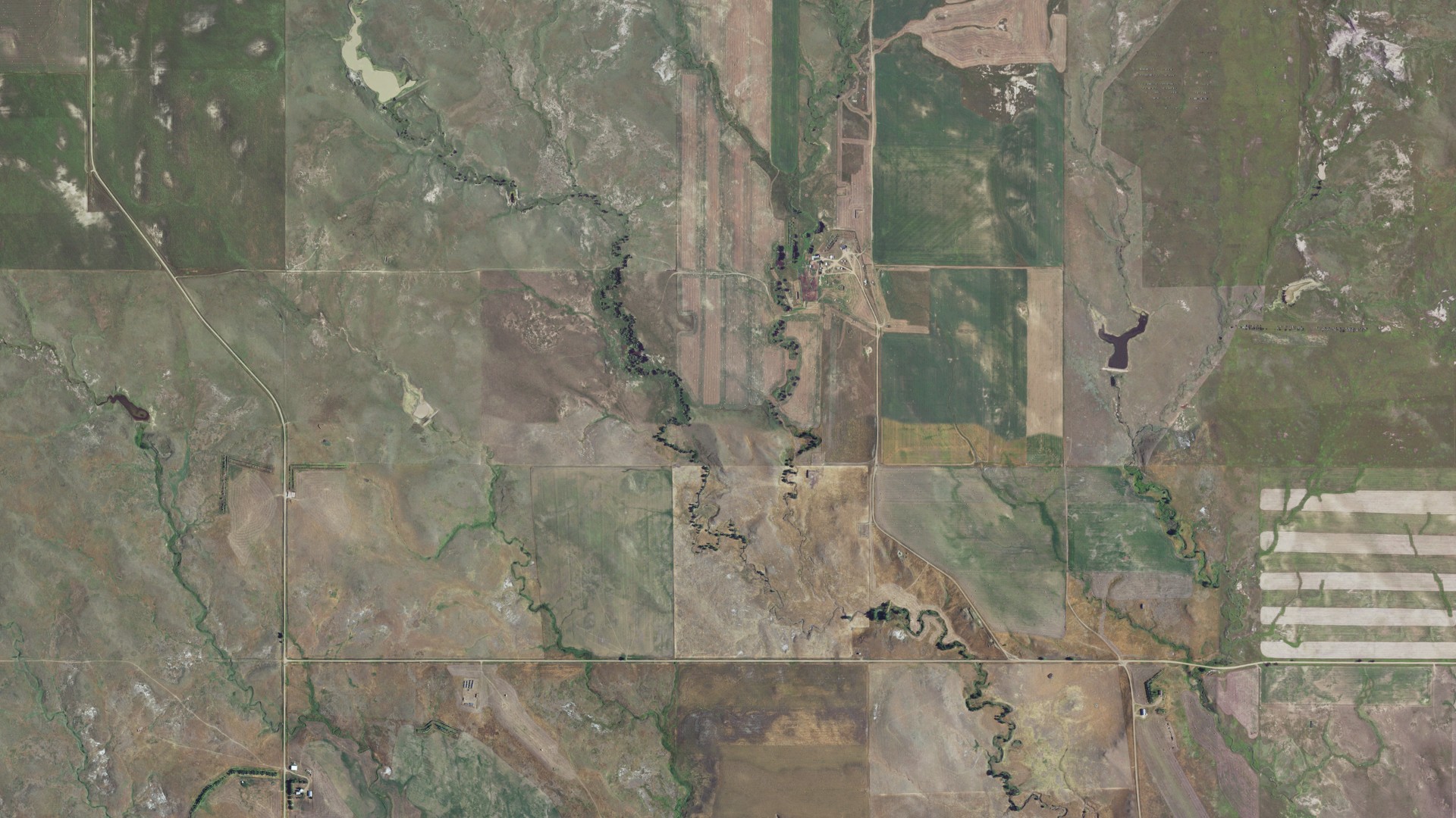 Natural-color aerial photograph of land around Duell, South Dakota
