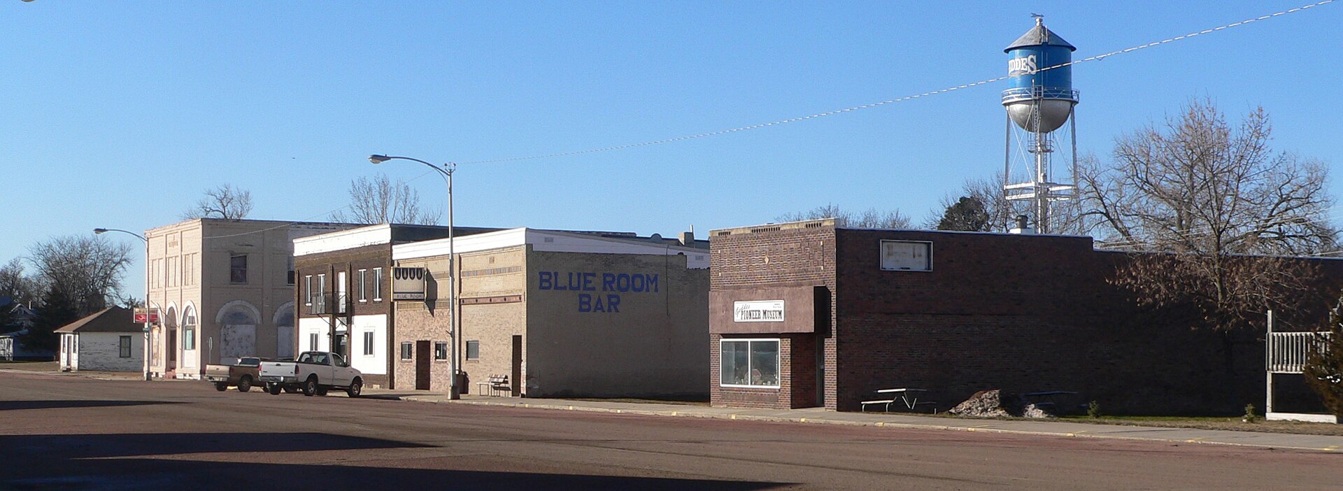 West side of Main Street in Geddes, South Dakota. Camera is facing southwest from about the intersection of Main and Third Street.