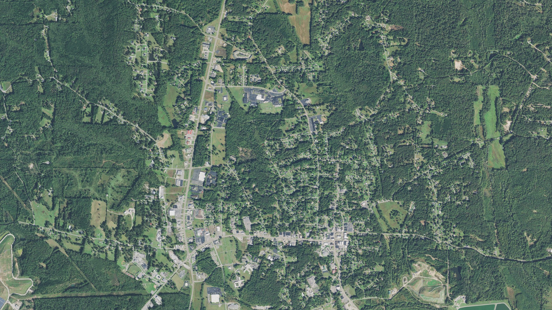 Natural-color aerial photograph of land around Camden, Tennessee
