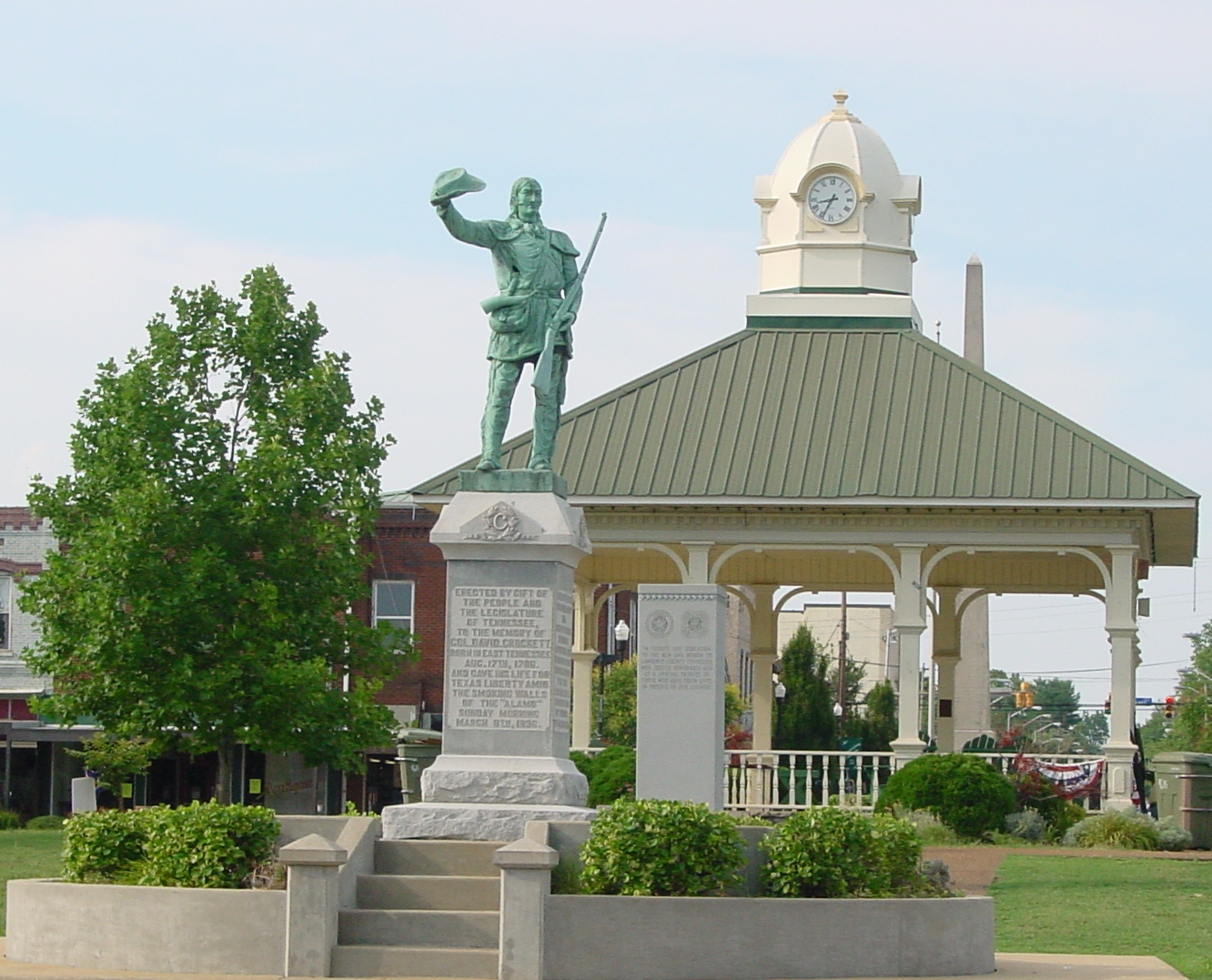 This photograph is of the town square in Lawrenceburg, TN with a statue of David Crockett in the center. — Tennessee