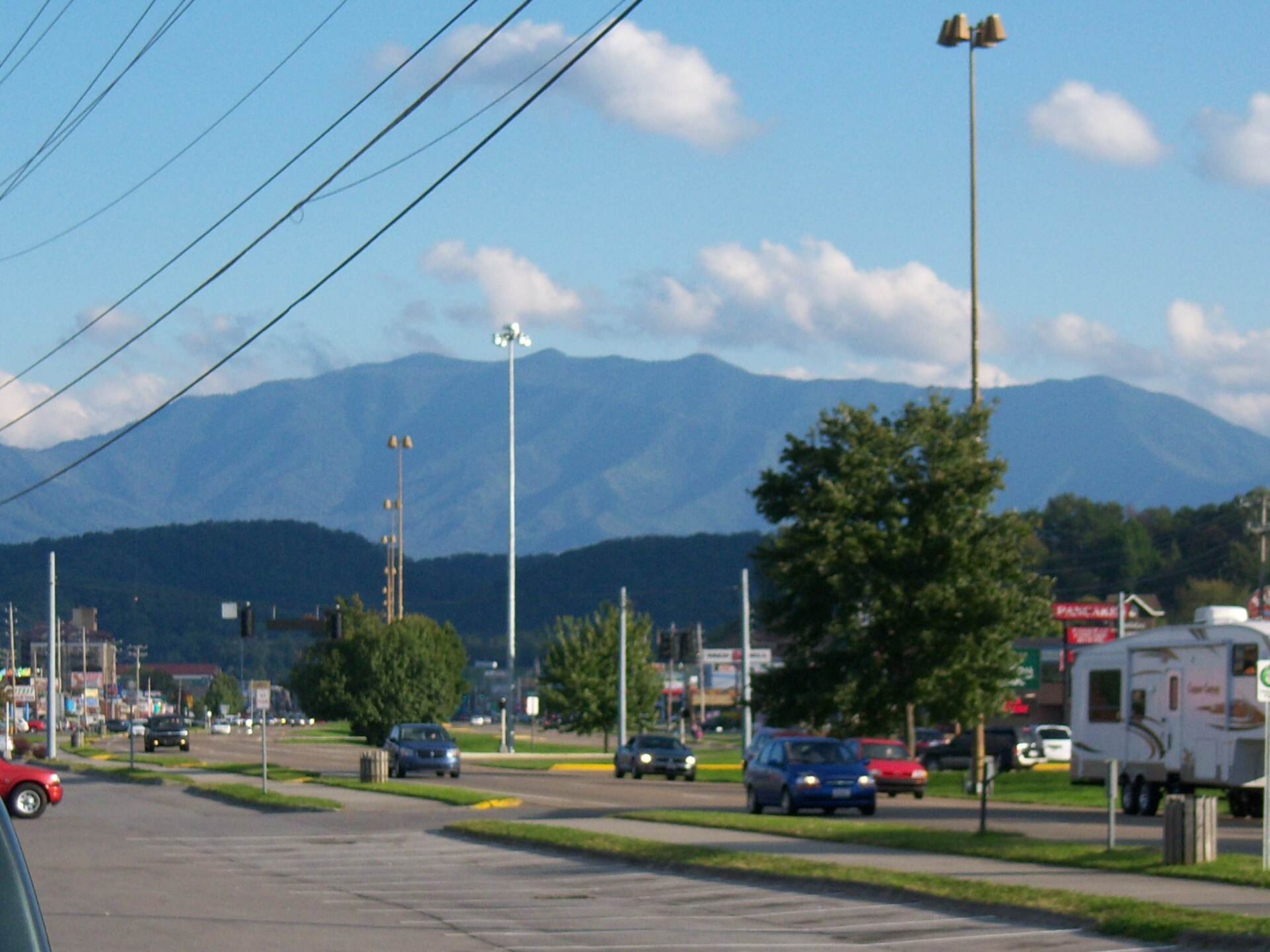 The city of Pigeon Forge, Tennessee with Mount Le Conte in the background.