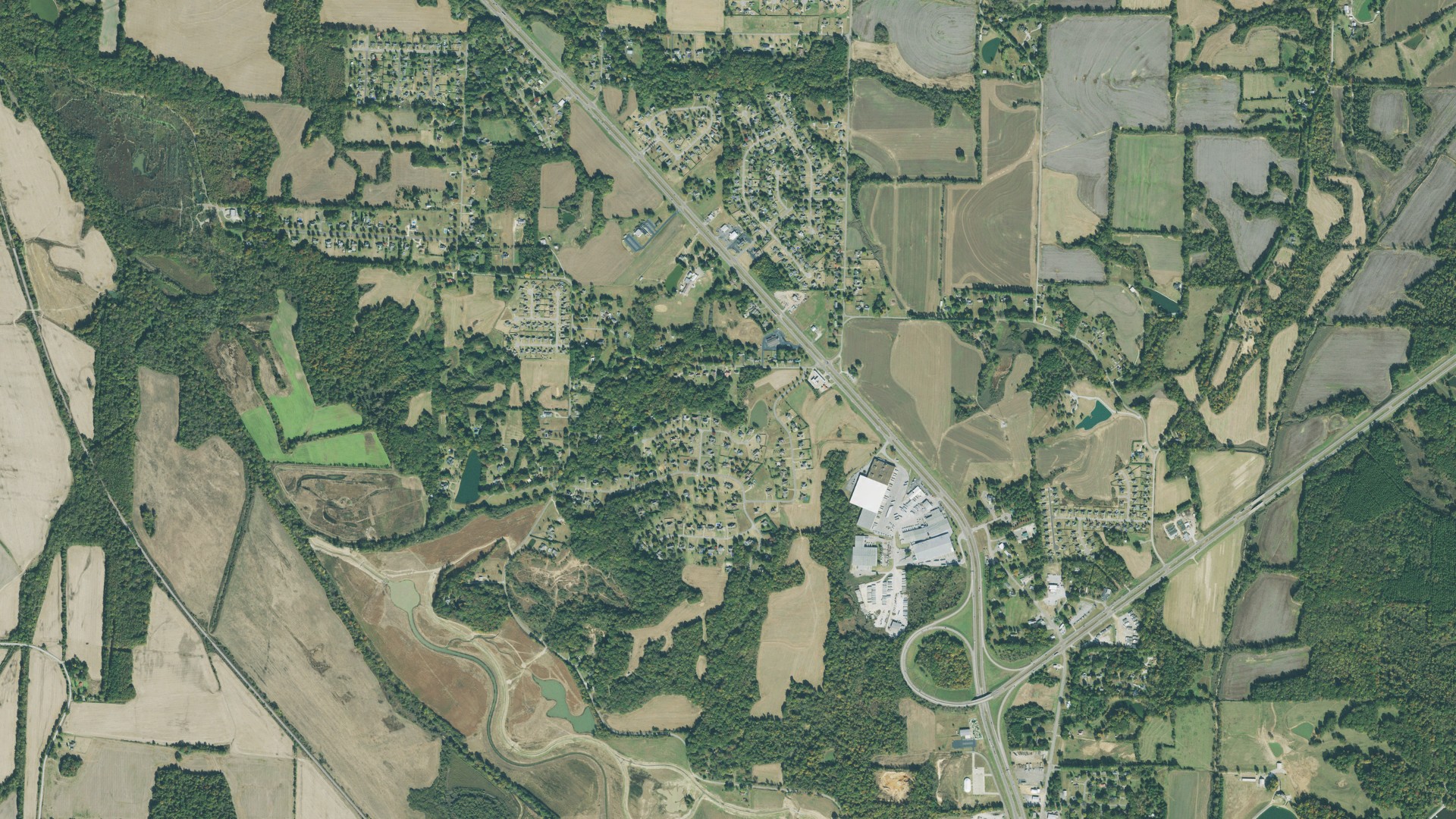 Natural-color aerial photograph of land around Three Way, Tennessee