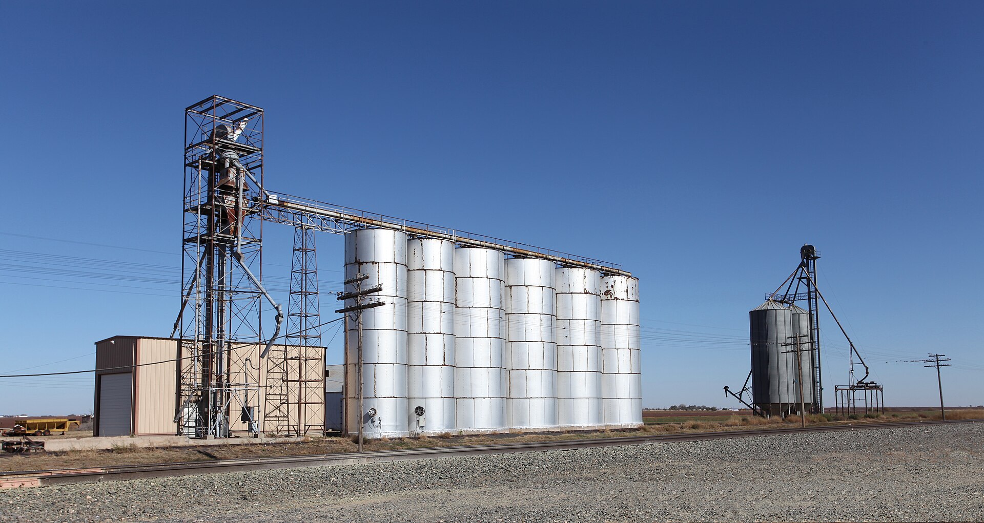 Small grain elevators alongside the BNSF tracks, Amherst, Texas.