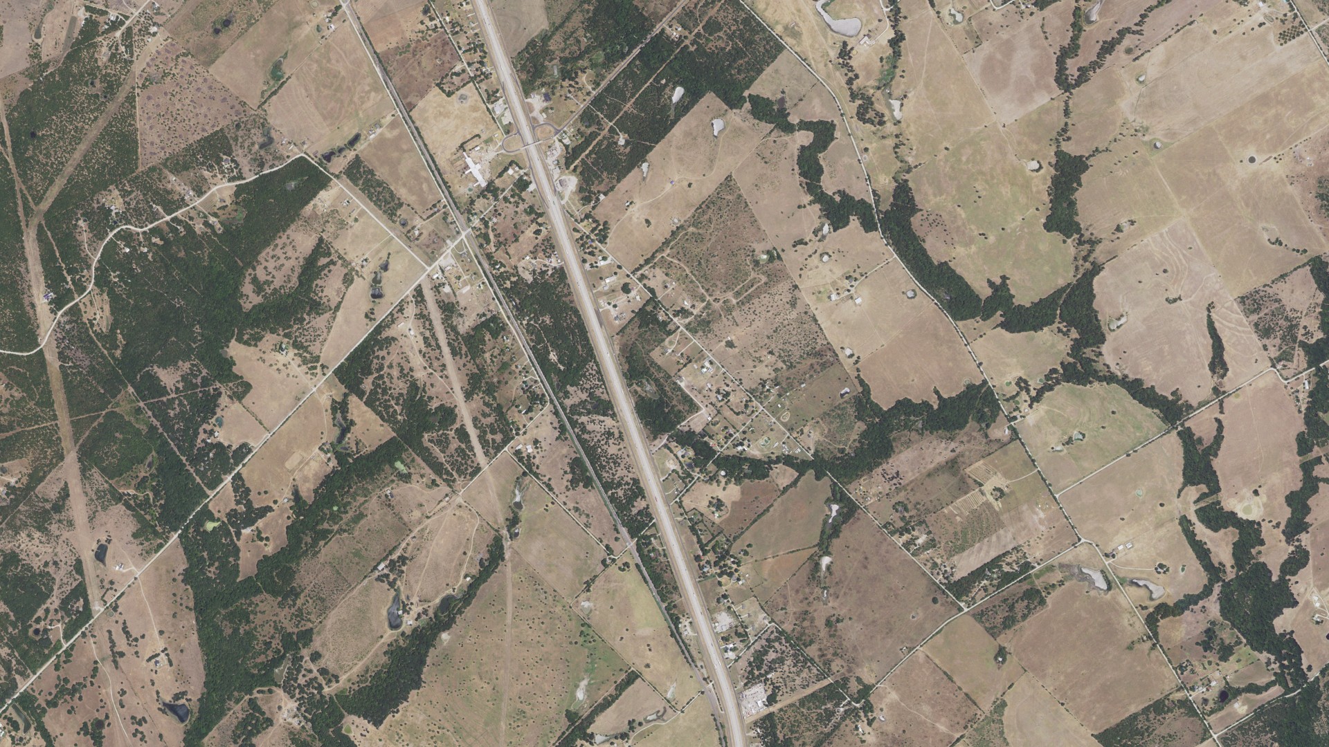 Natural-color aerial photograph of land around Angus, Texas
