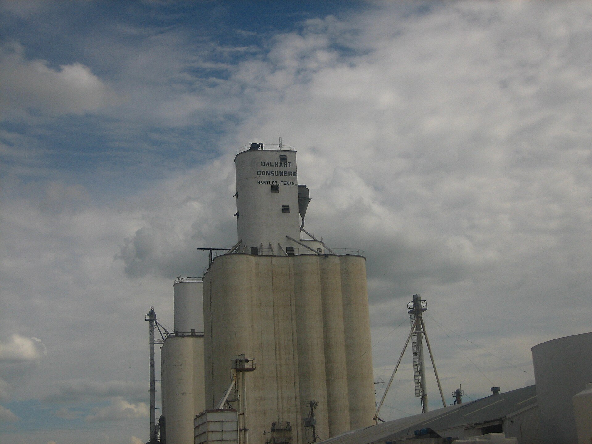 This grain elevator is located in Hartley, Texas! Not Dalhart. It is written on top of the elevator!!