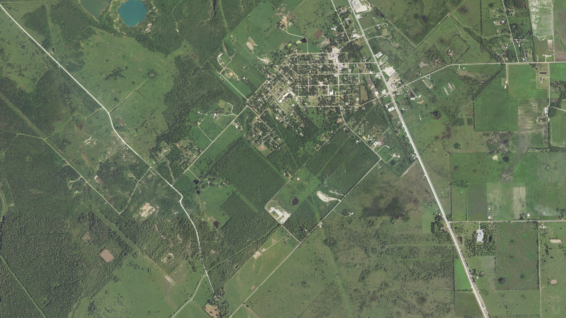 Natural-color aerial photograph of land around Damon, Texas