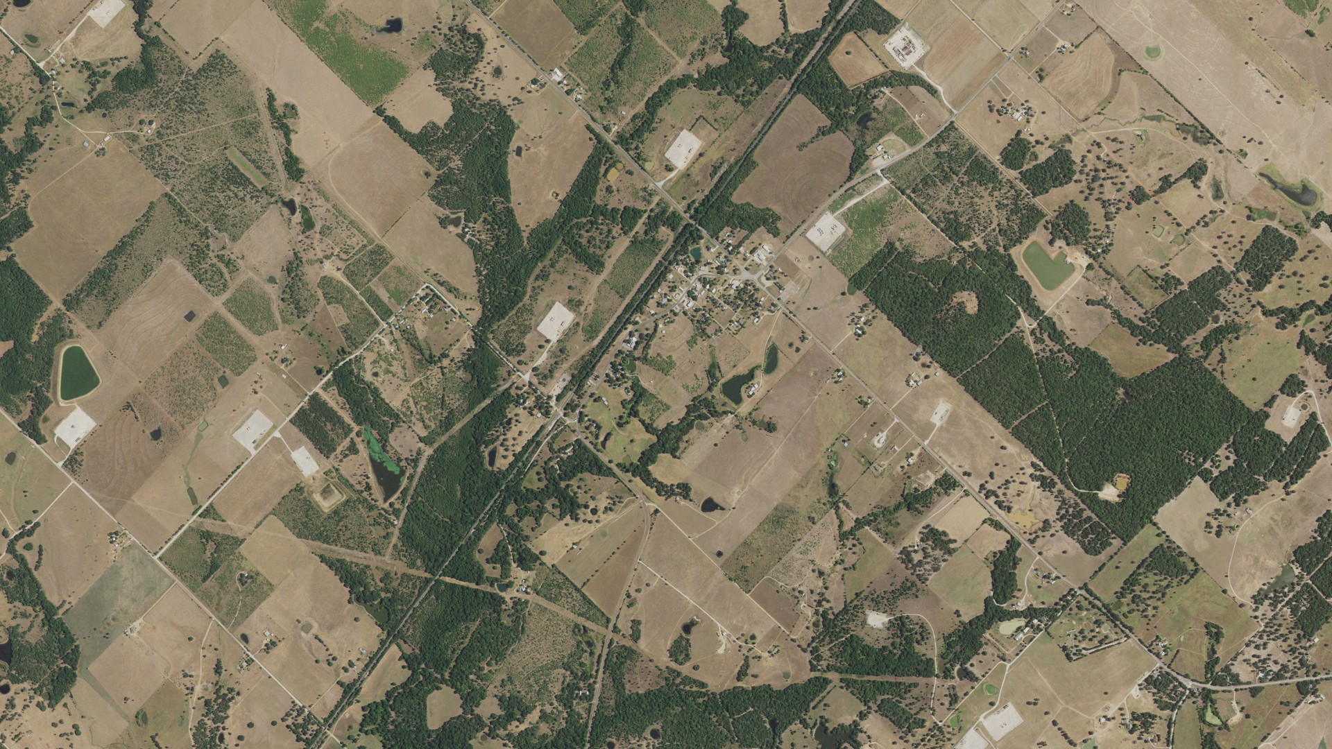 Natural-color aerial photograph of land around Deanville, Texas