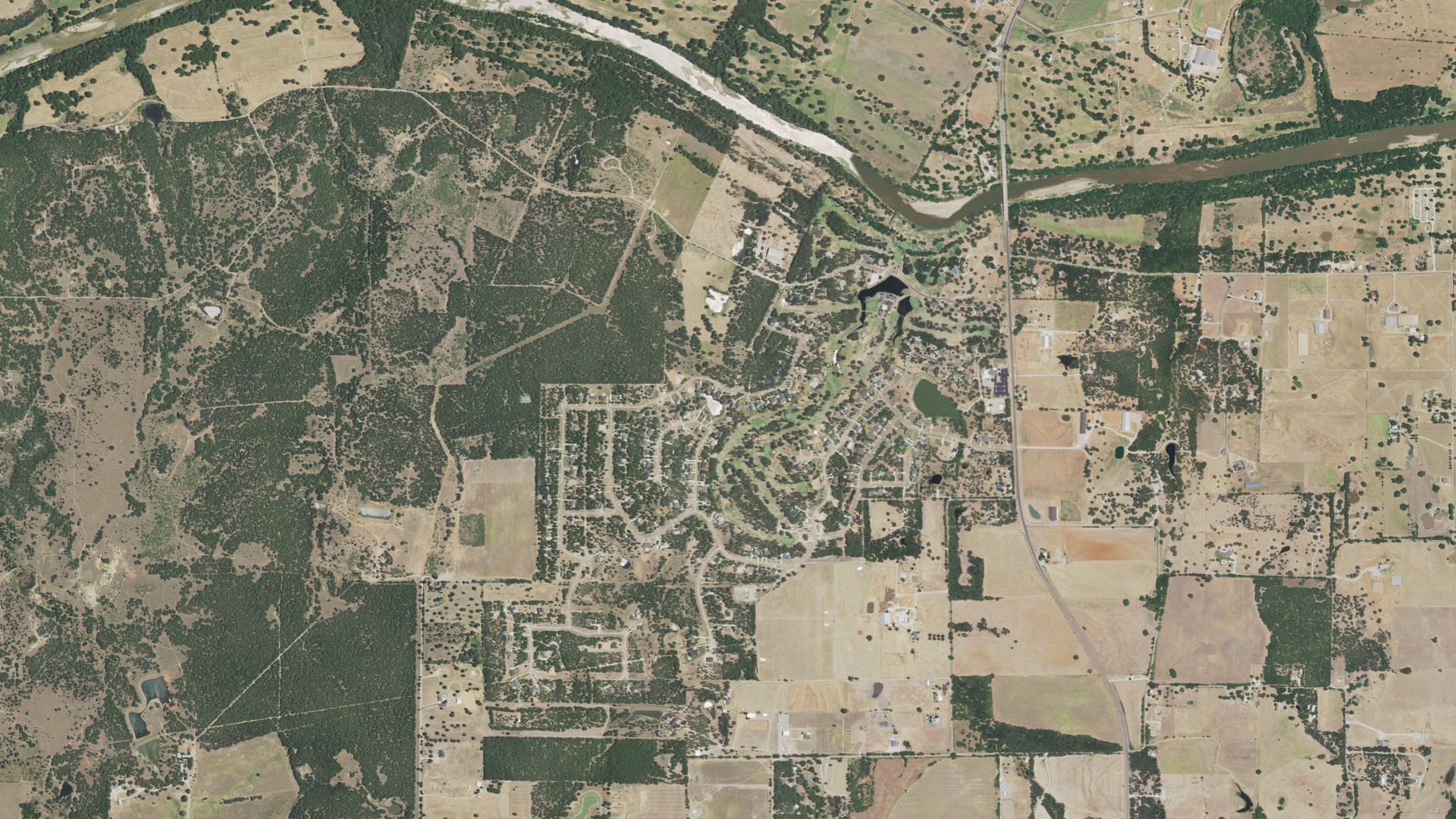 Natural-color aerial photograph of land around Dennis, Texas