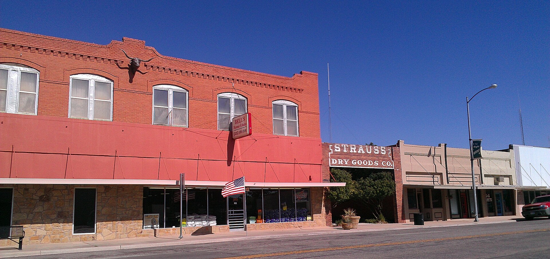 Strauss Dry Goods Co. Storefront converted into a public park and adjoining building in Hamlin, Texas.