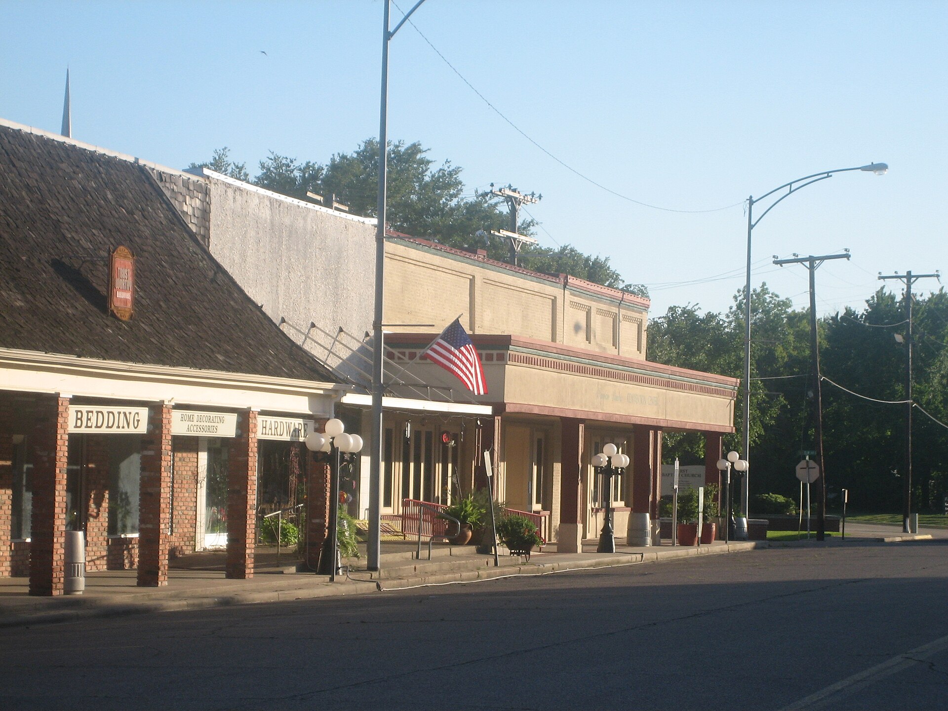 South side of 100 West block of Trinity Street, Madisonville, Texas, looking west towards Elm Street.