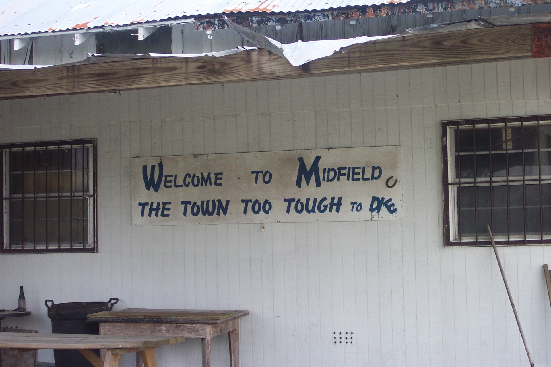 A sign on a store in the tiny community of Midfield, TX — Texas
