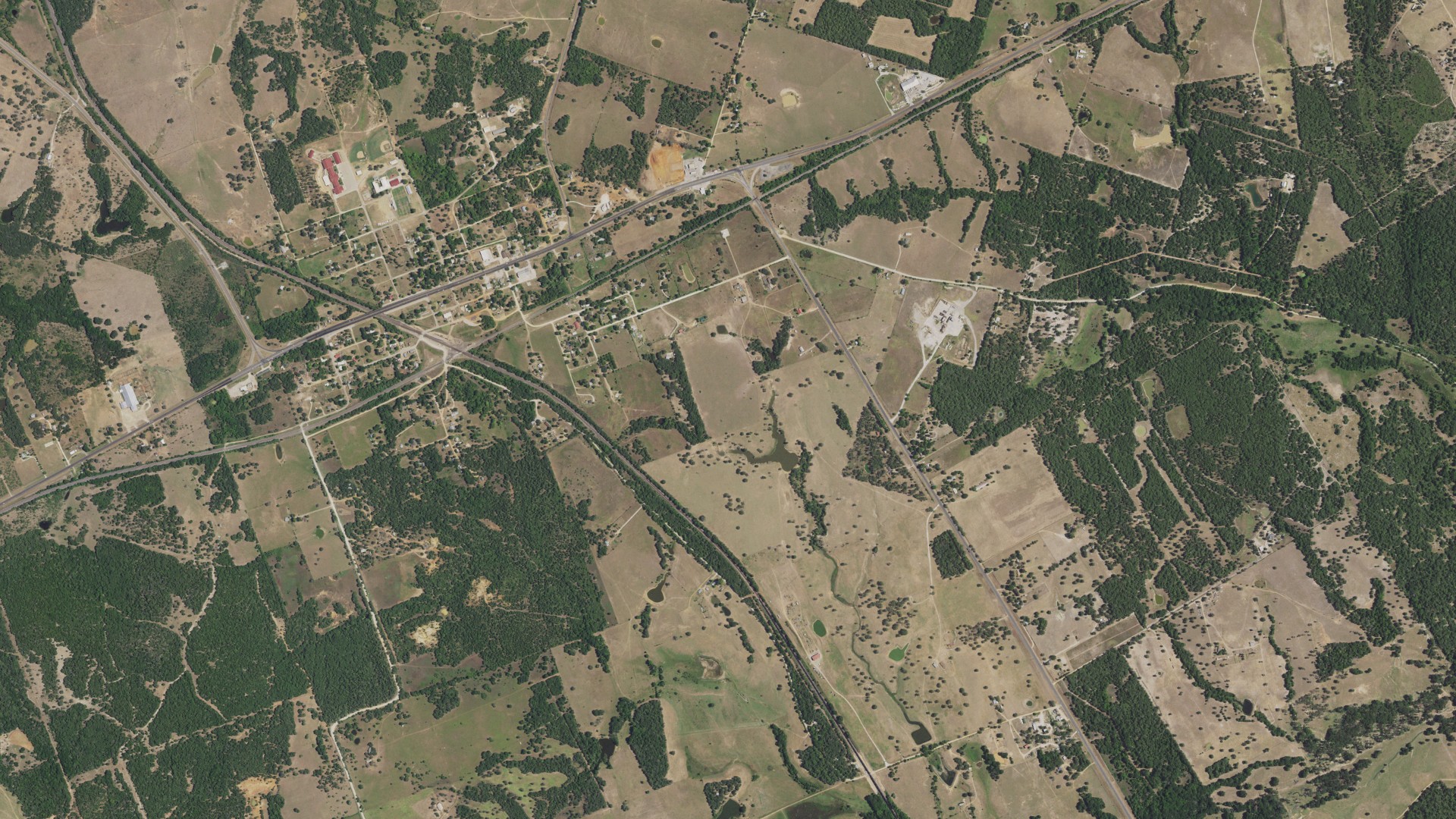 Natural-color aerial photograph of land around Milano, Texas