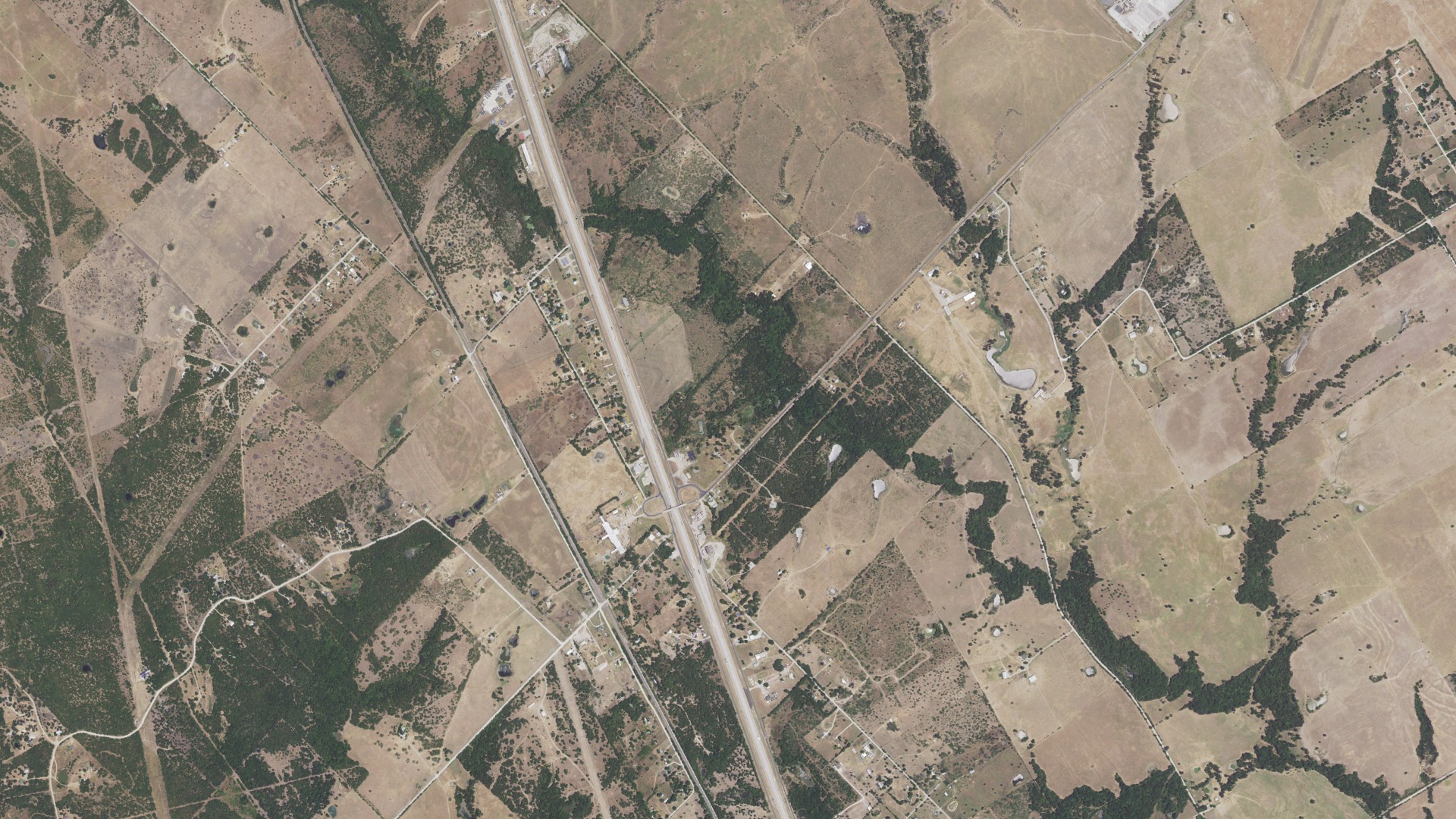 Natural-color aerial photograph of land around Mustang, Texas
