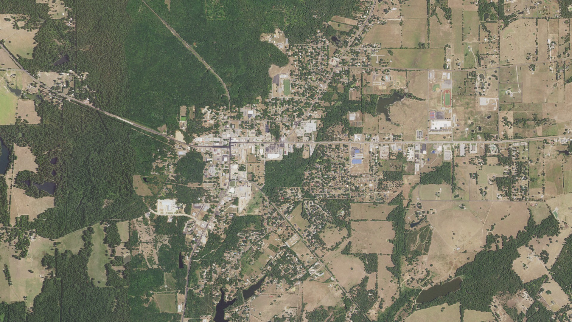 Natural-color aerial photograph of land around Quitman, Texas