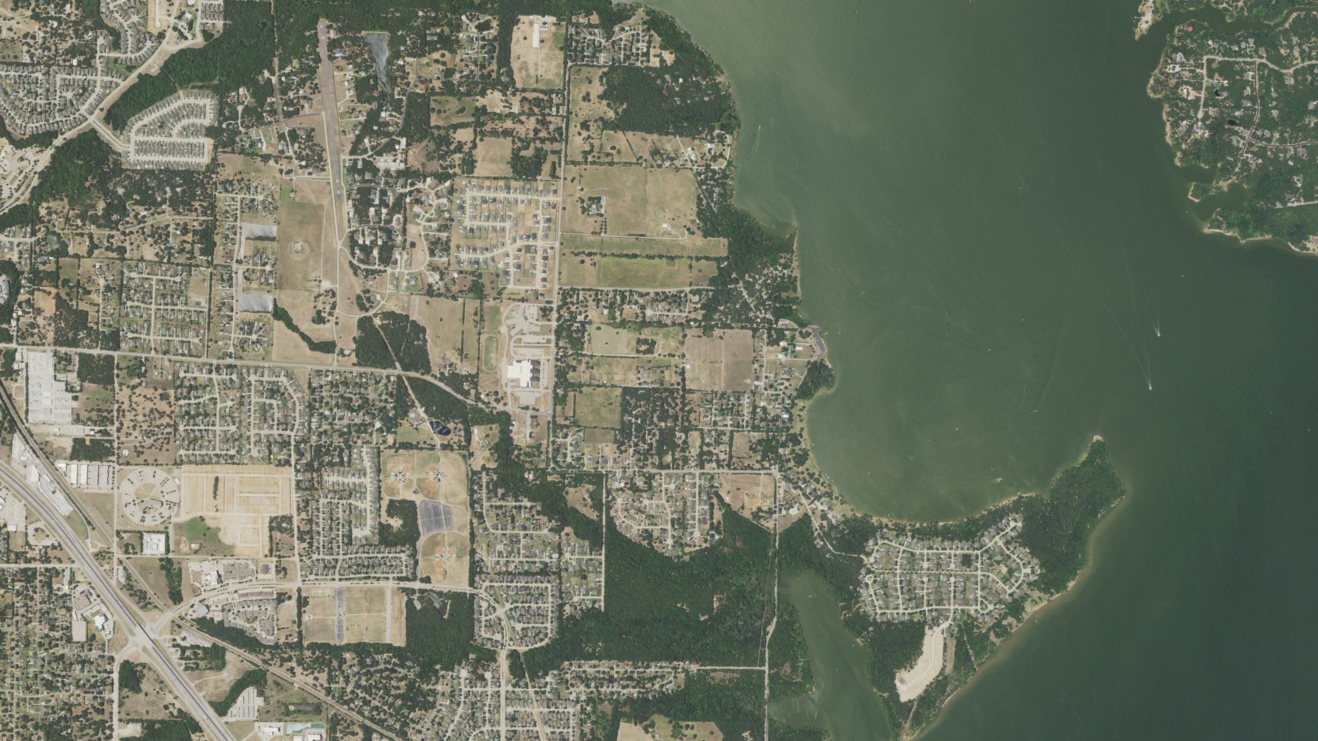 Natural-color aerial photograph of land around Shady Shores, Texas