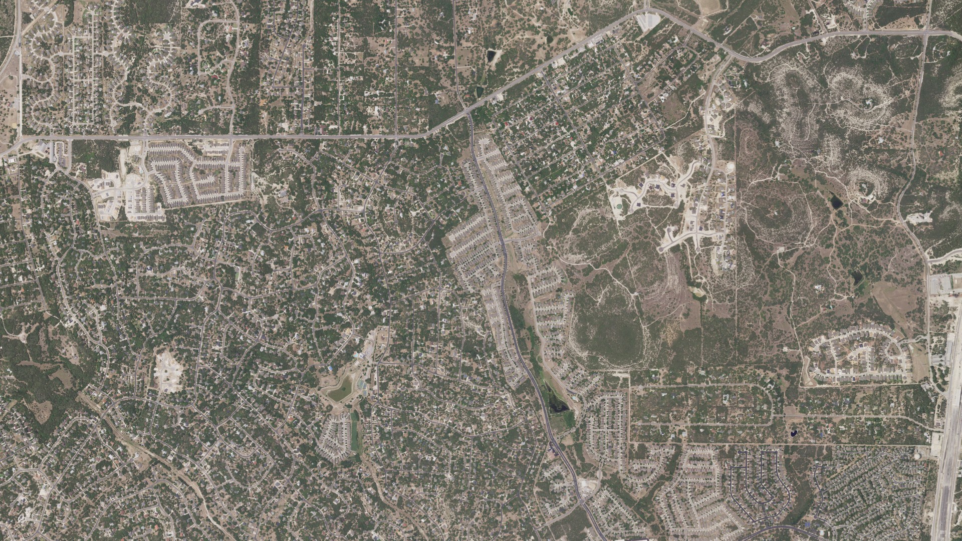 Natural-color aerial photograph of land around Timberwood Park, Texas