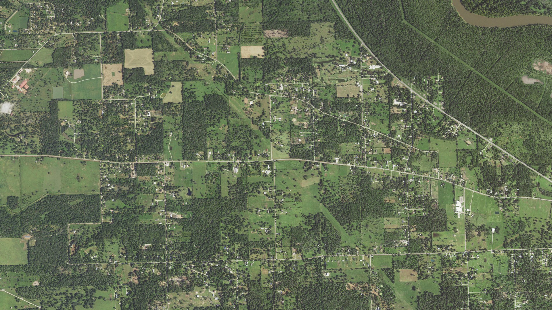 Natural-color aerial photograph of land around Wild Peach Village, Texas