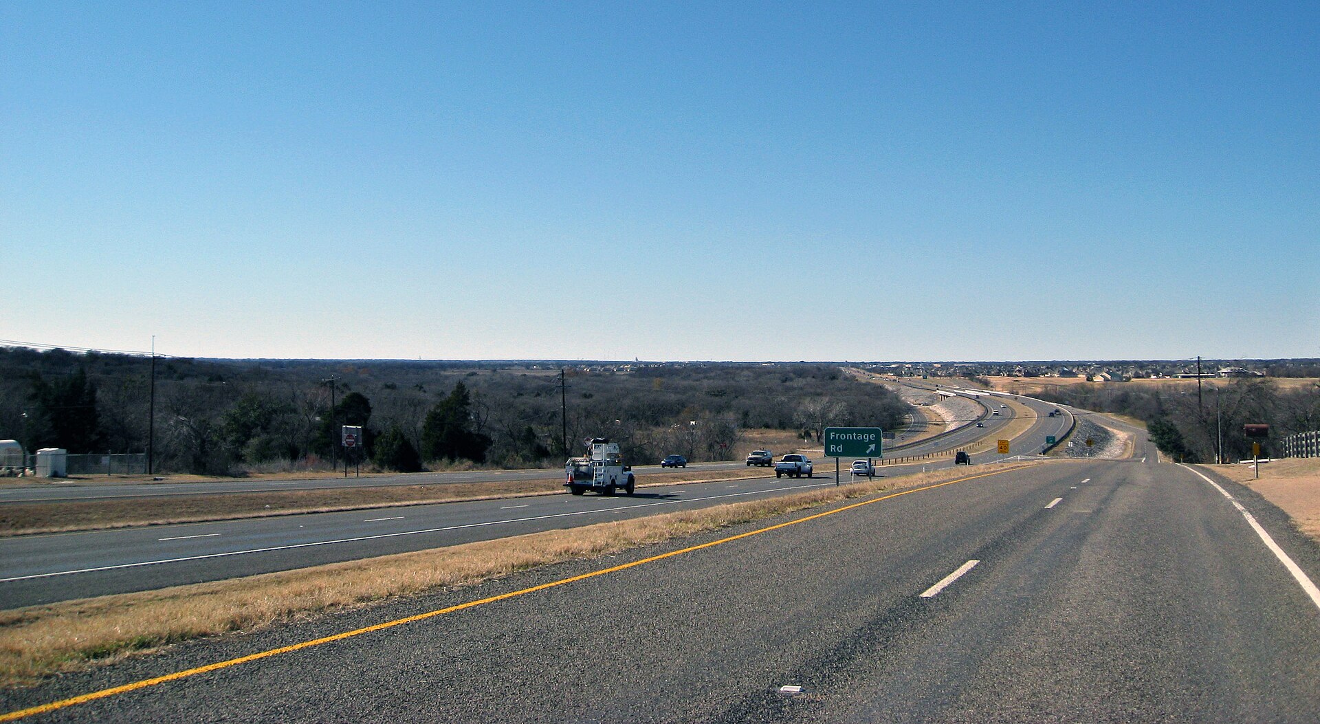 U.S. Route 84 in Woodway, Texas, exiting onto a frontage road.