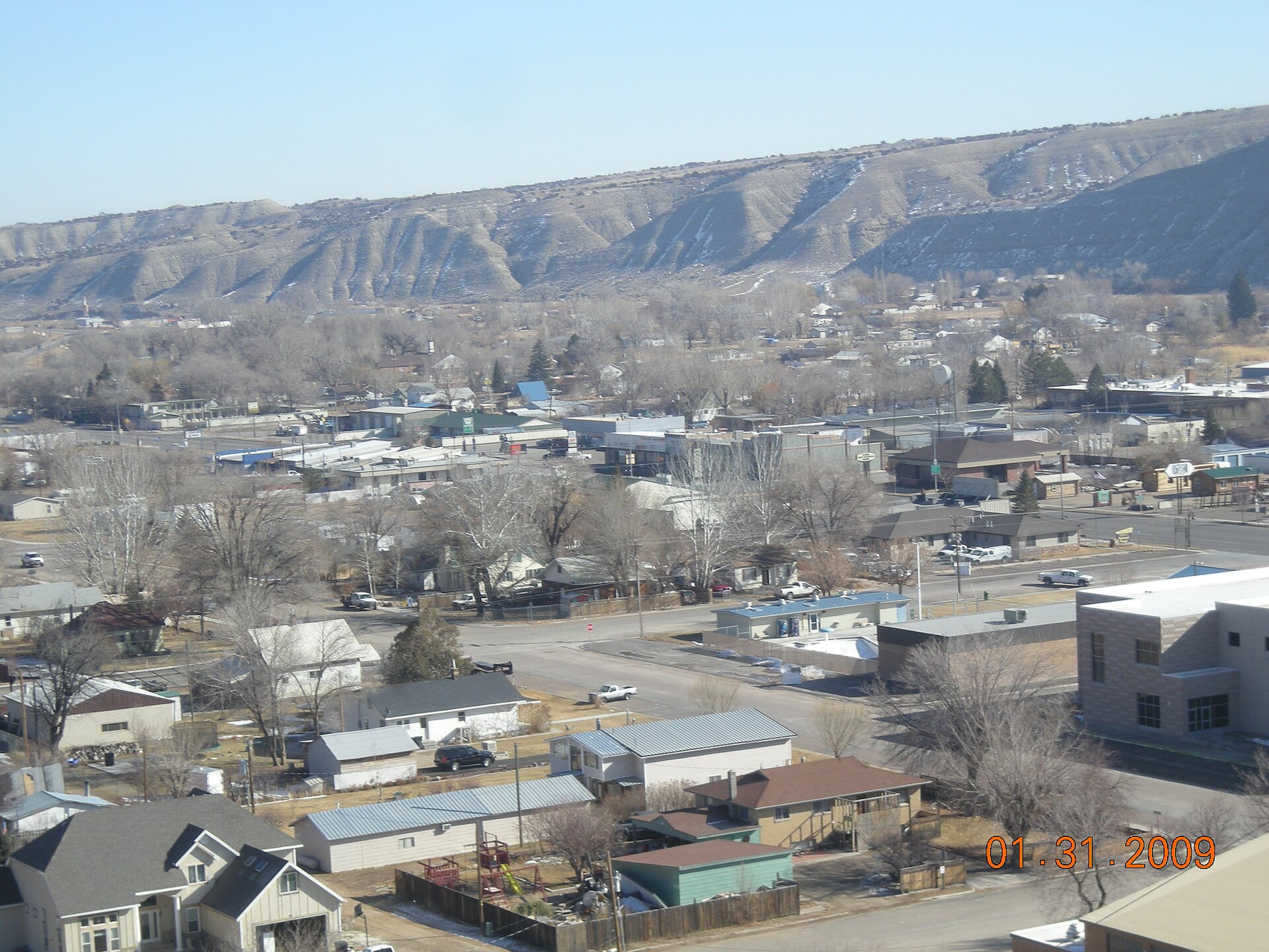 Duchesne Utah from the top of the west bench water tank. The buildings in the center of the picture are the old Kohls market and Commercial Club.
