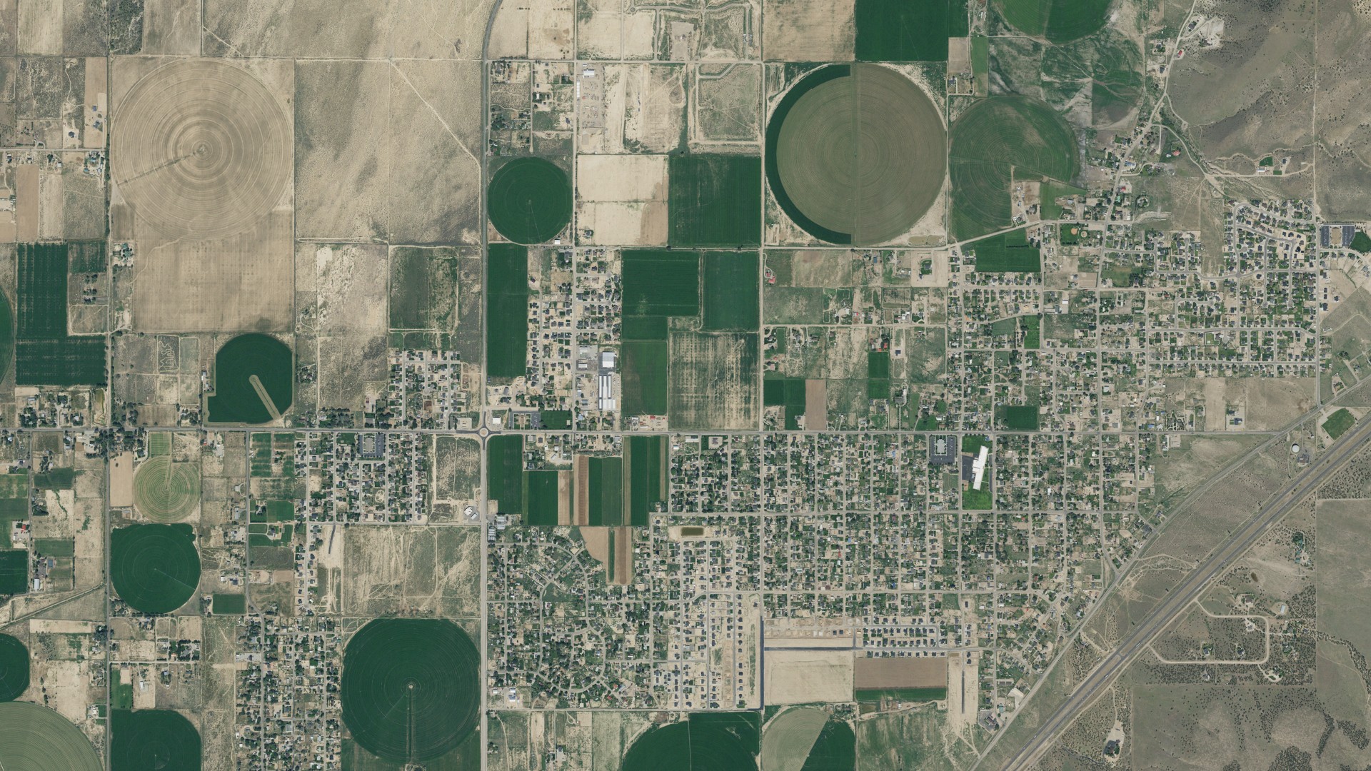 Natural-color aerial photograph of land around Enoch, Utah