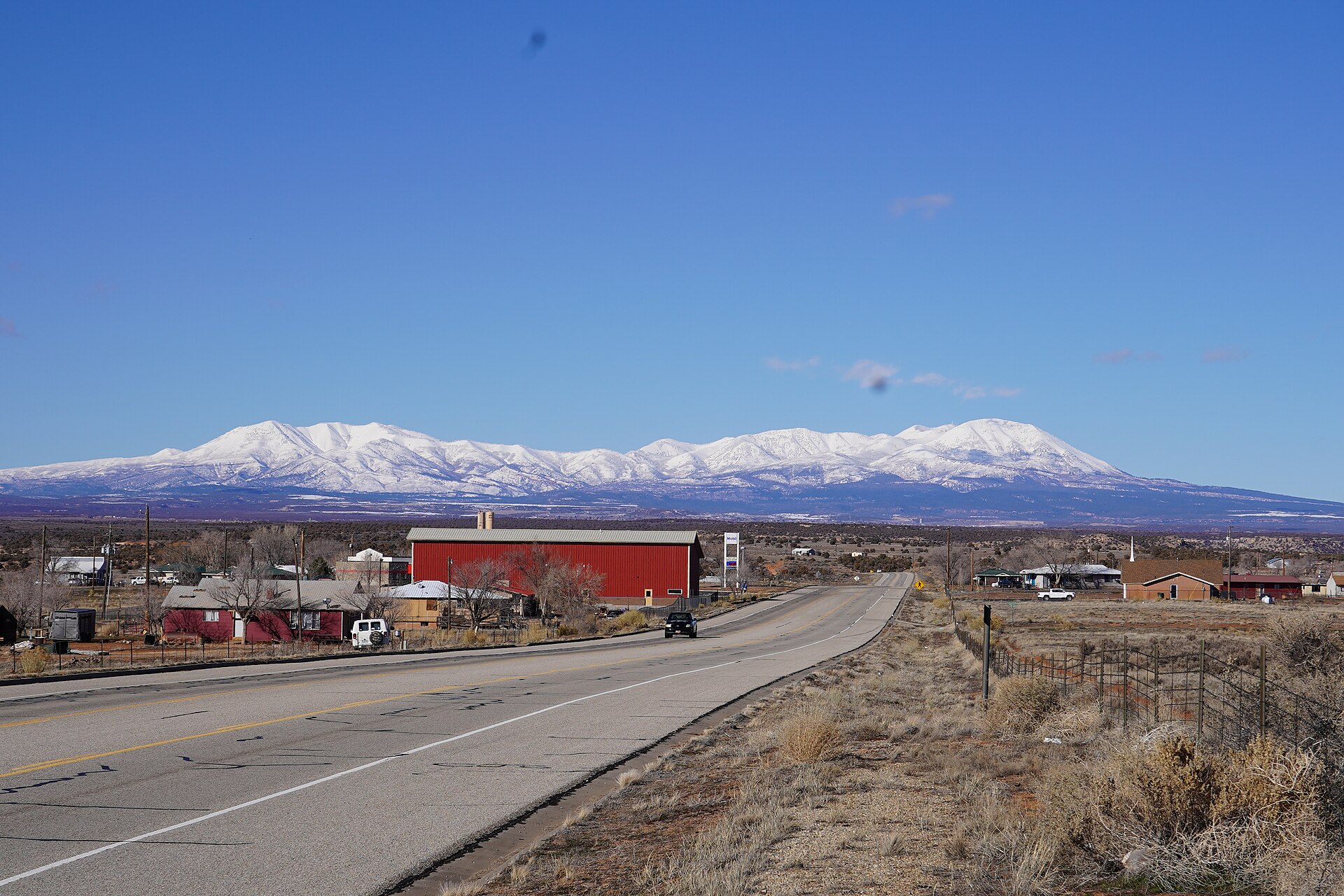 The photograph is of White Mesa, Utah, taken facing north along the primary road through the town.