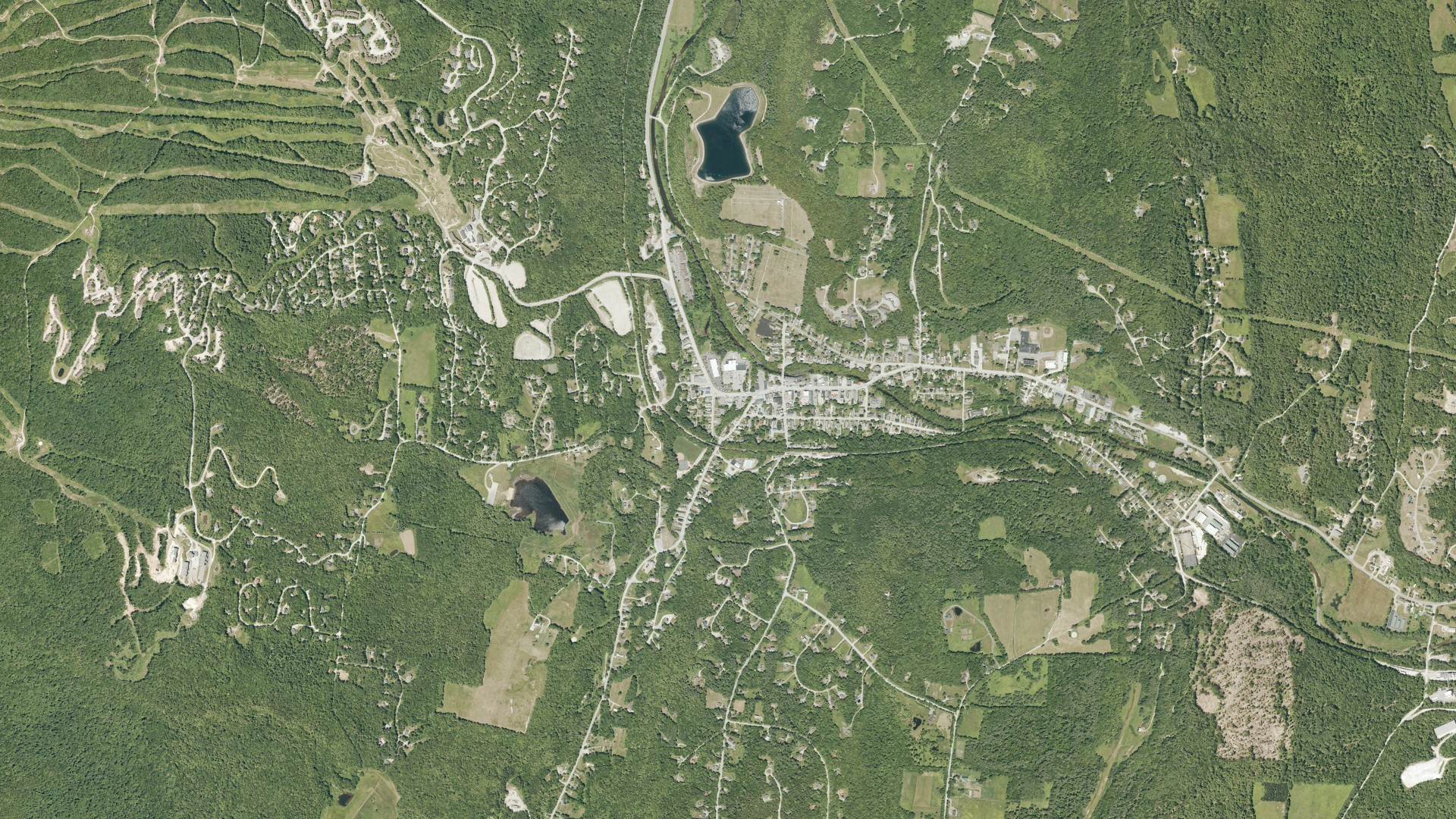 Natural-color aerial photograph of land around Ludlow, Vermont
