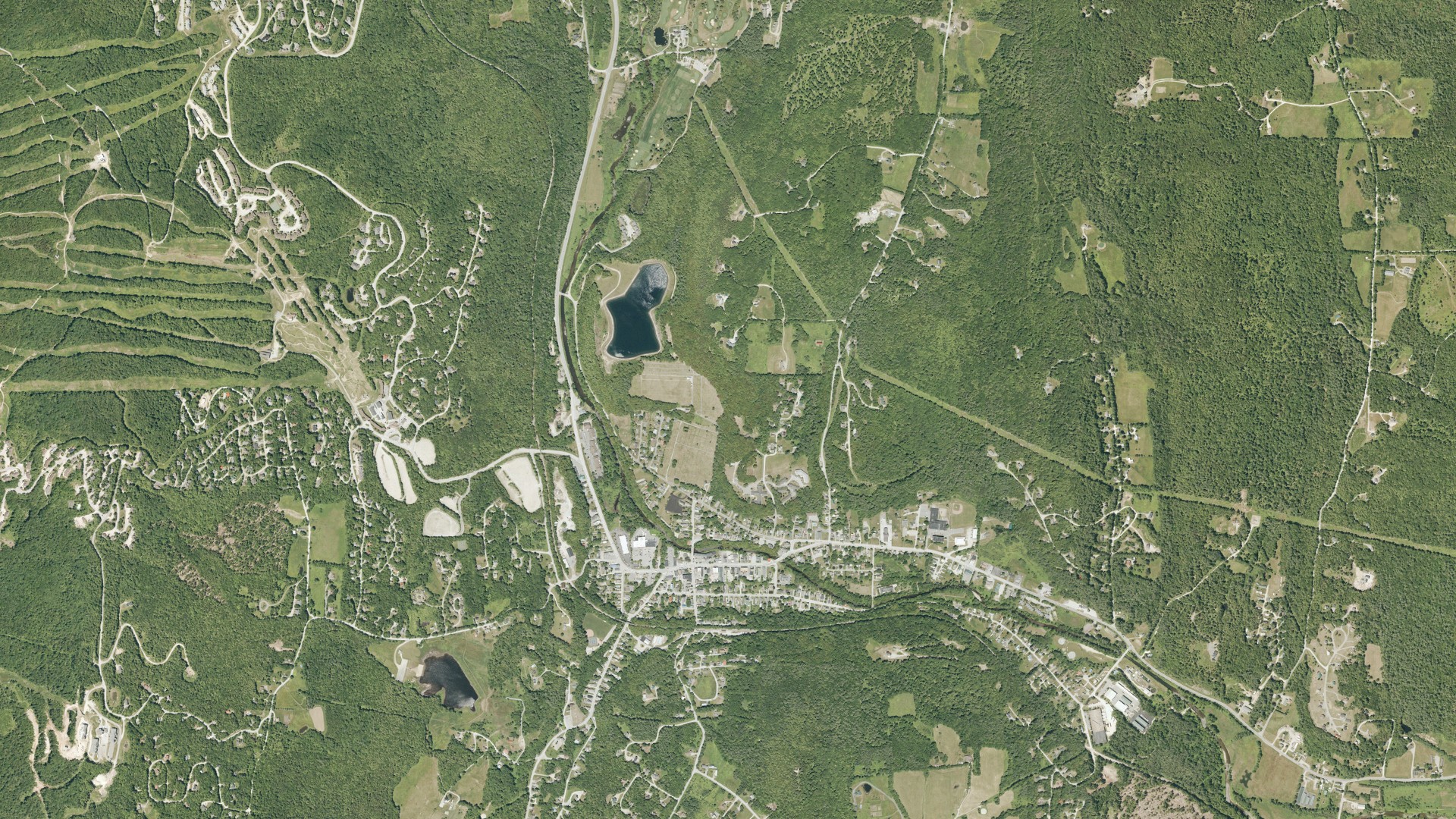 Natural-color aerial photograph of land around Ludlow, Vermont
