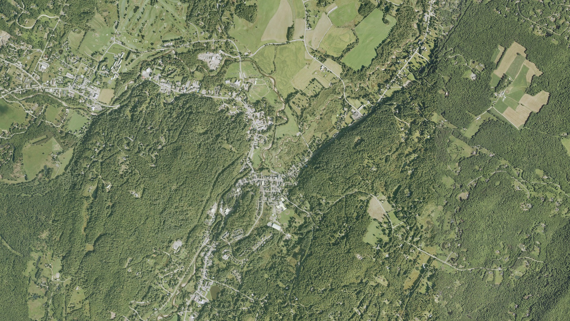 Natural-color aerial photograph of land around Stowe, Vermont