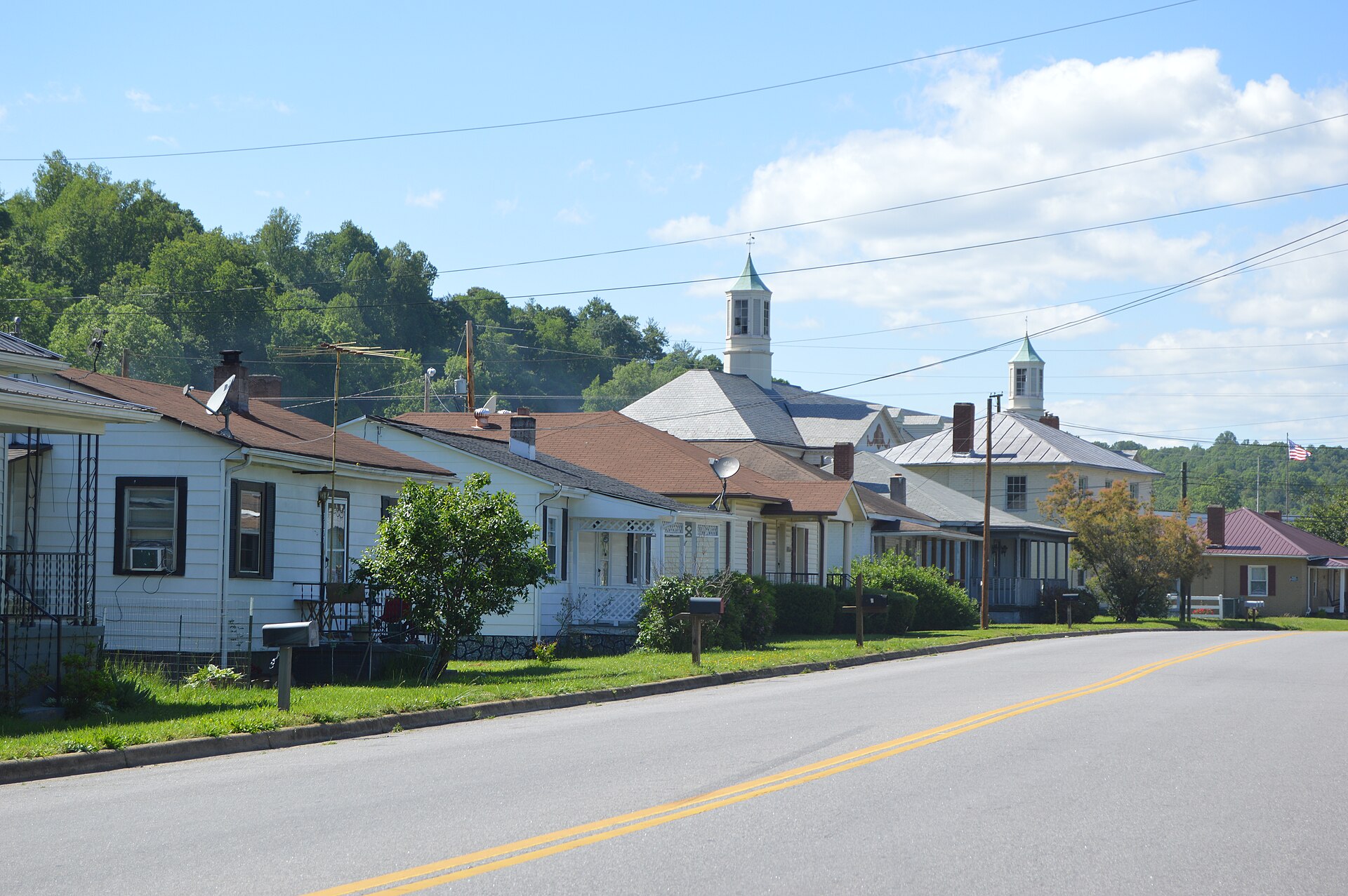 Houses on the western side of Fairystone Park Highway in Bassett, Virginia, United States. In the background sits John D. Bassett High School.