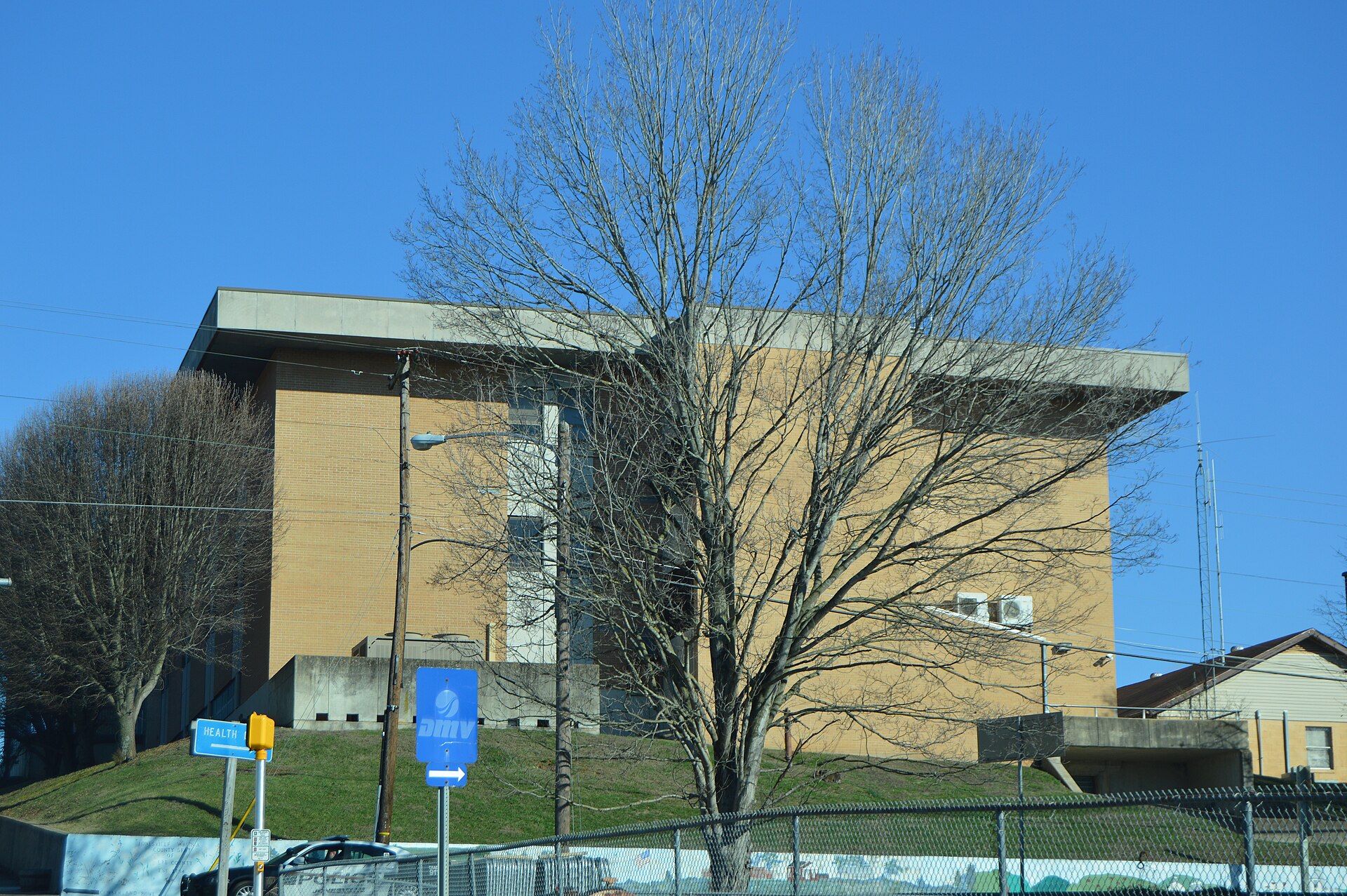 Western end of the Lee County Courthouse, located at the intersection of Park (U.S. Route 58) and Main Streets in downtown Jonesville, Virginia, United States.