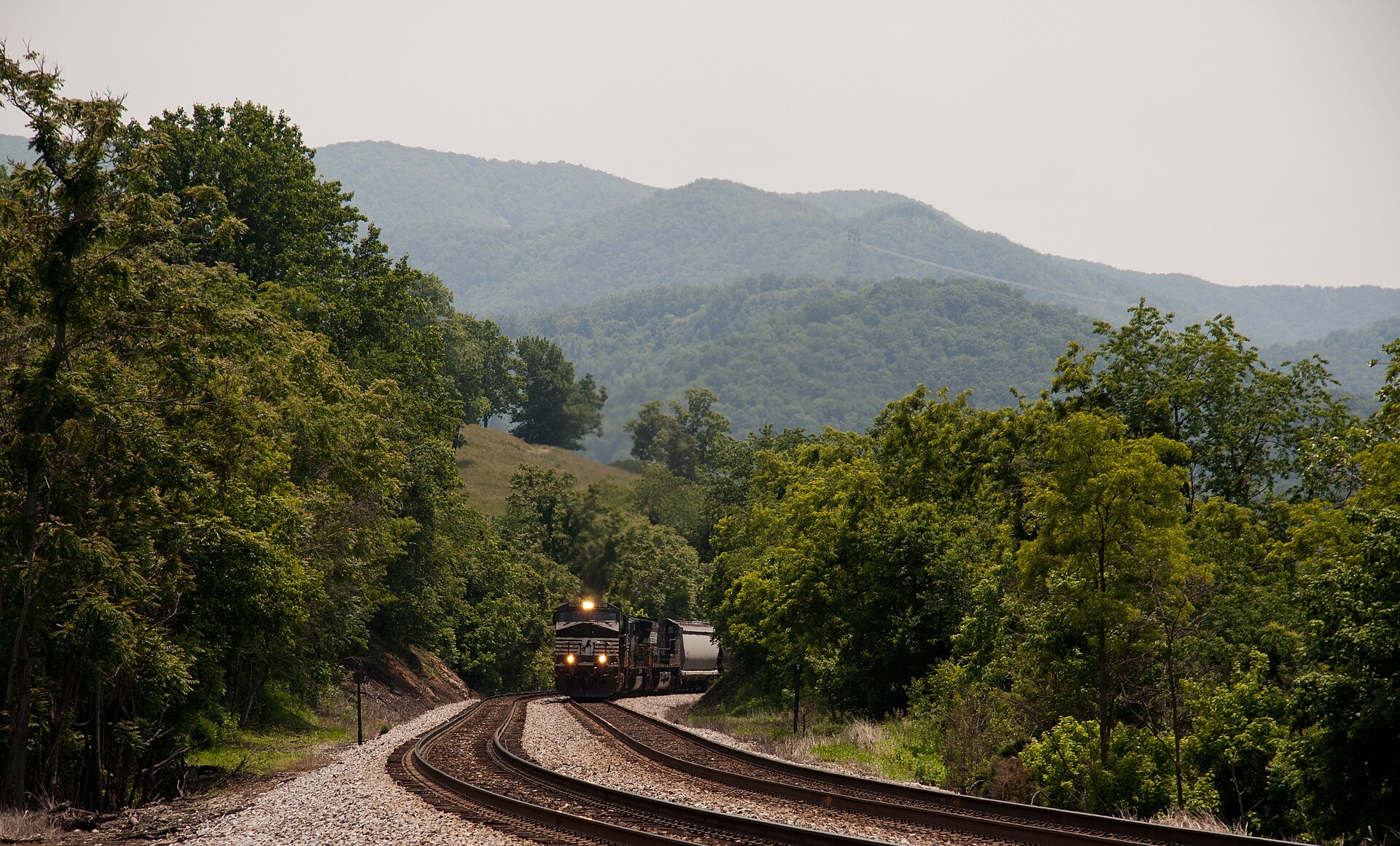 A long mixed freight grinds up the grade in Shawsville, VA on NS's Christiansburg district. — Virginia