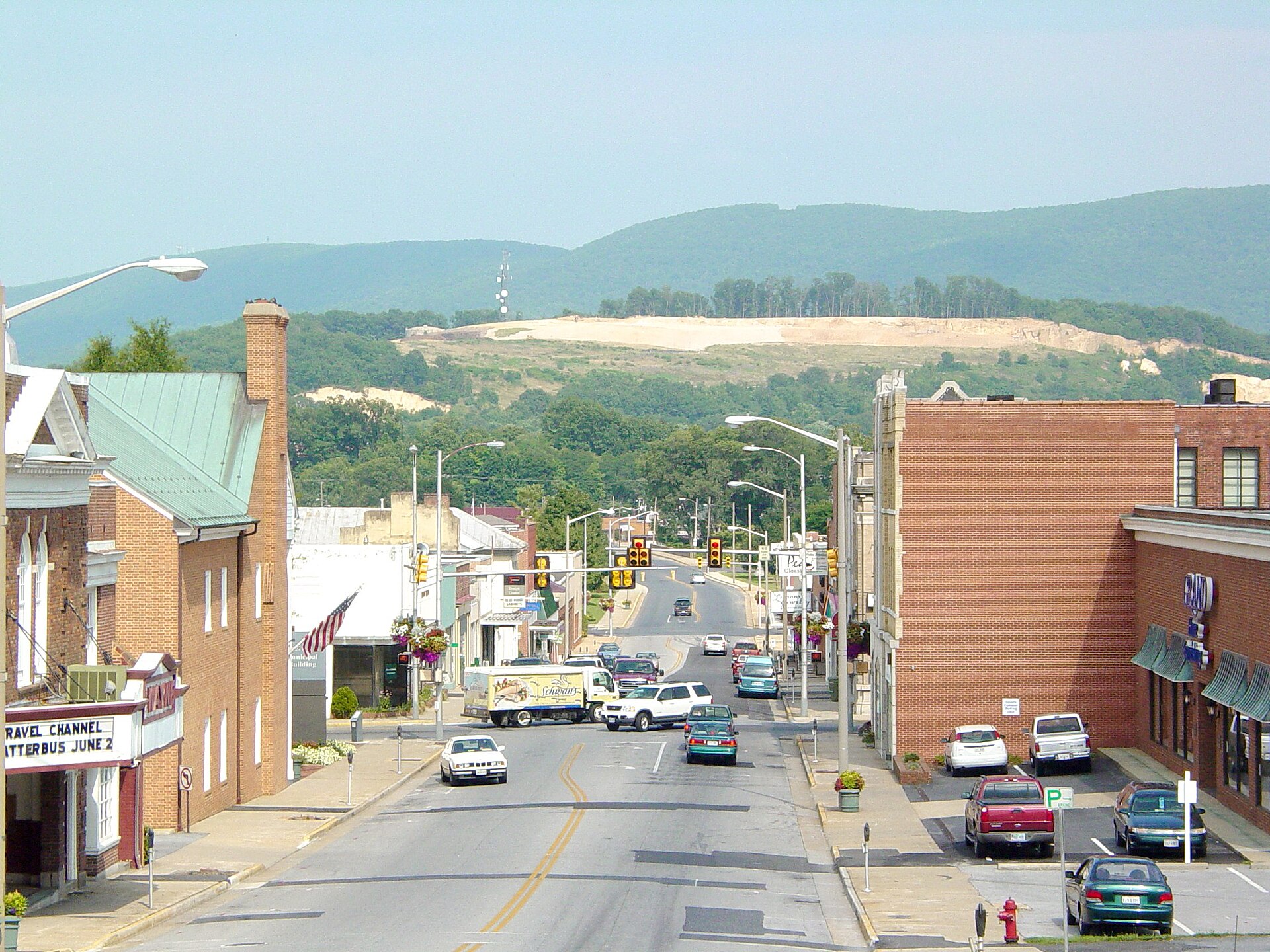 Downtown Waynesboro, Virginia showing Main Street, as well as the scar on the mountain prior to being seeded. The Wayne Theater is visible at the extreme left of the photo. — Waynesboro city, Virginia