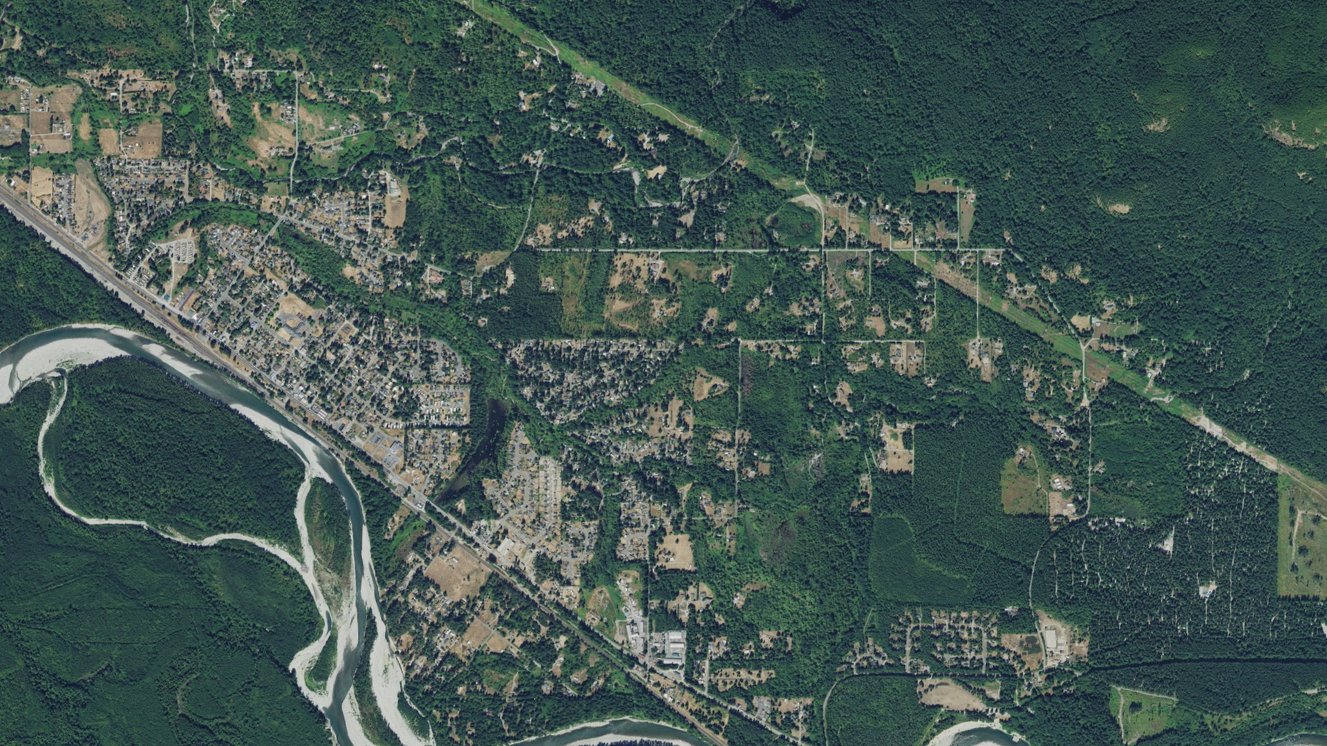 Natural-color aerial photograph of land around May Creek, Washington
