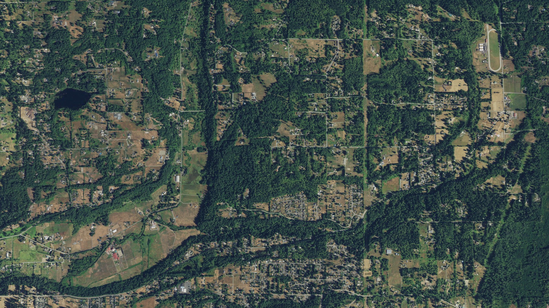 Natural-color aerial photograph of land around Woods Creek, Washington