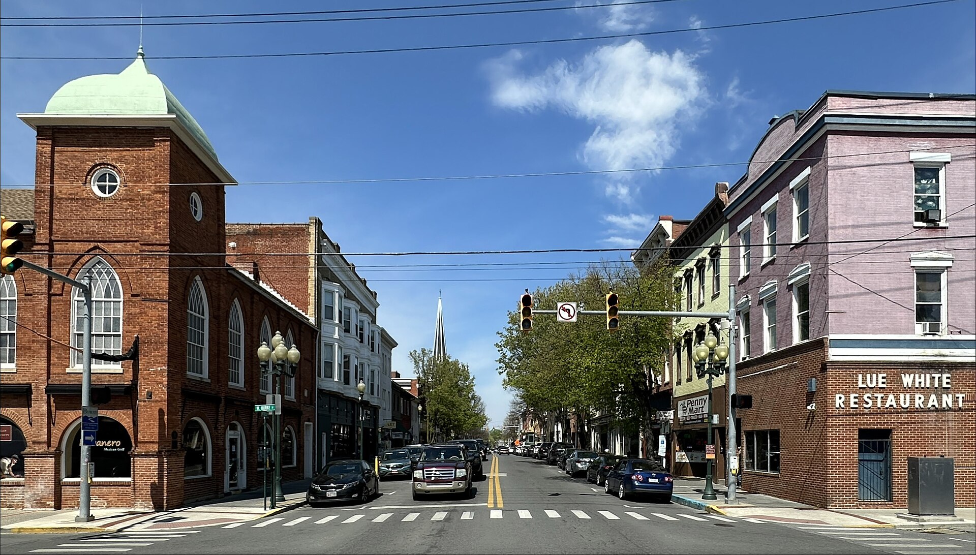 Facing north on Queen Street (at the intersection with Burke Street) in Martinsburg, West Virginia. The buildings are contributing properties to the Downtown Martinsburg Historic District.